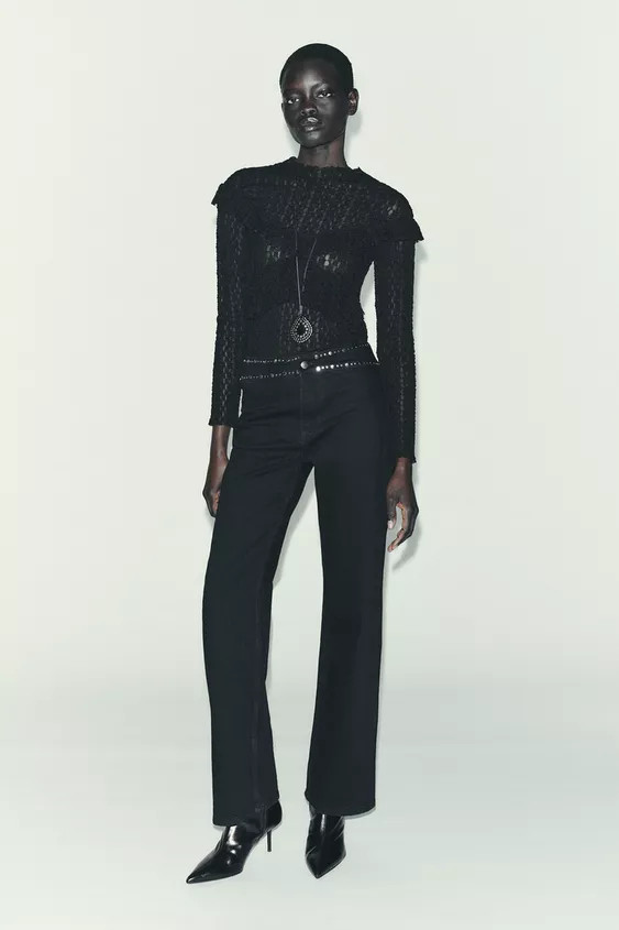 Top made in lace-like fabric. Round neck and long sleeves. Ruffle detail in the same fabric. | Zara US