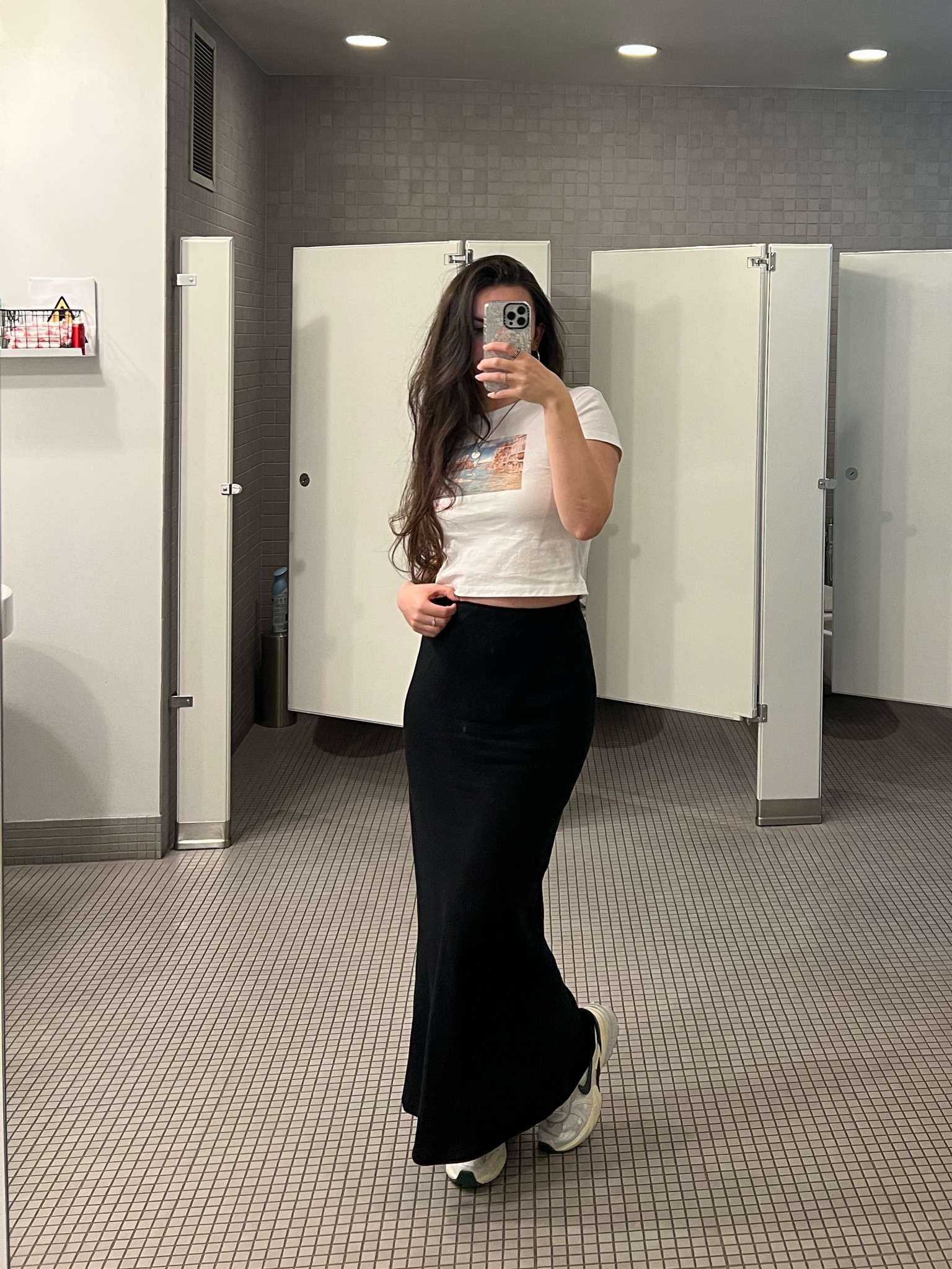 Simple outfit for work or errands. White Y2K style baby tee, long black skirt, Nike chunky sneakers

#LTKstyletip #LTKfindsunder100 #LTKMostLoved