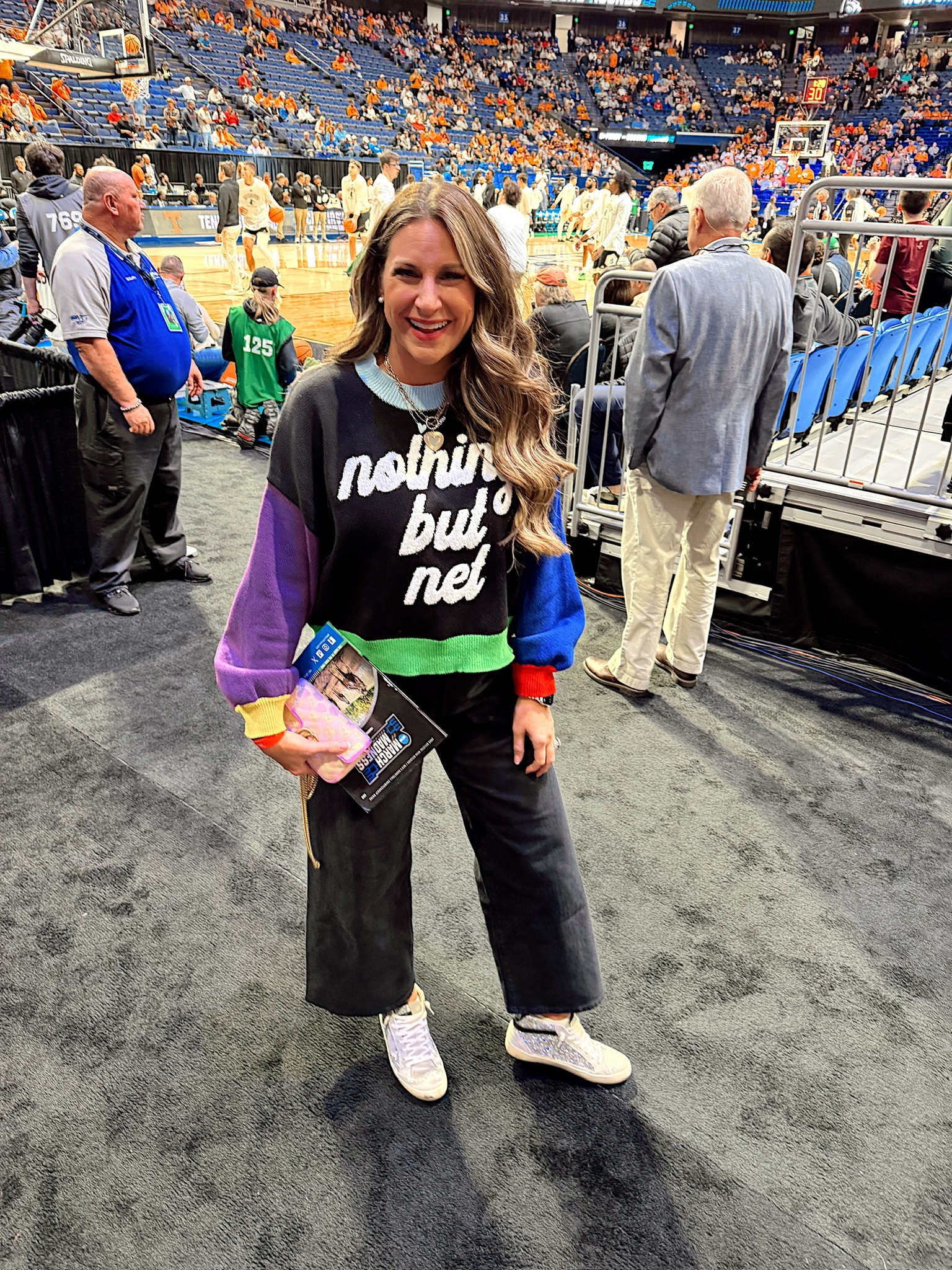 In a medium queen of sparkles nothing but net sweater, size 6 target wide leg cropped jeans, sequin sneakers and accessories for March Madness - all fits tts.

#LTKTravel #LTKShoeCrush #LTKStyleTip