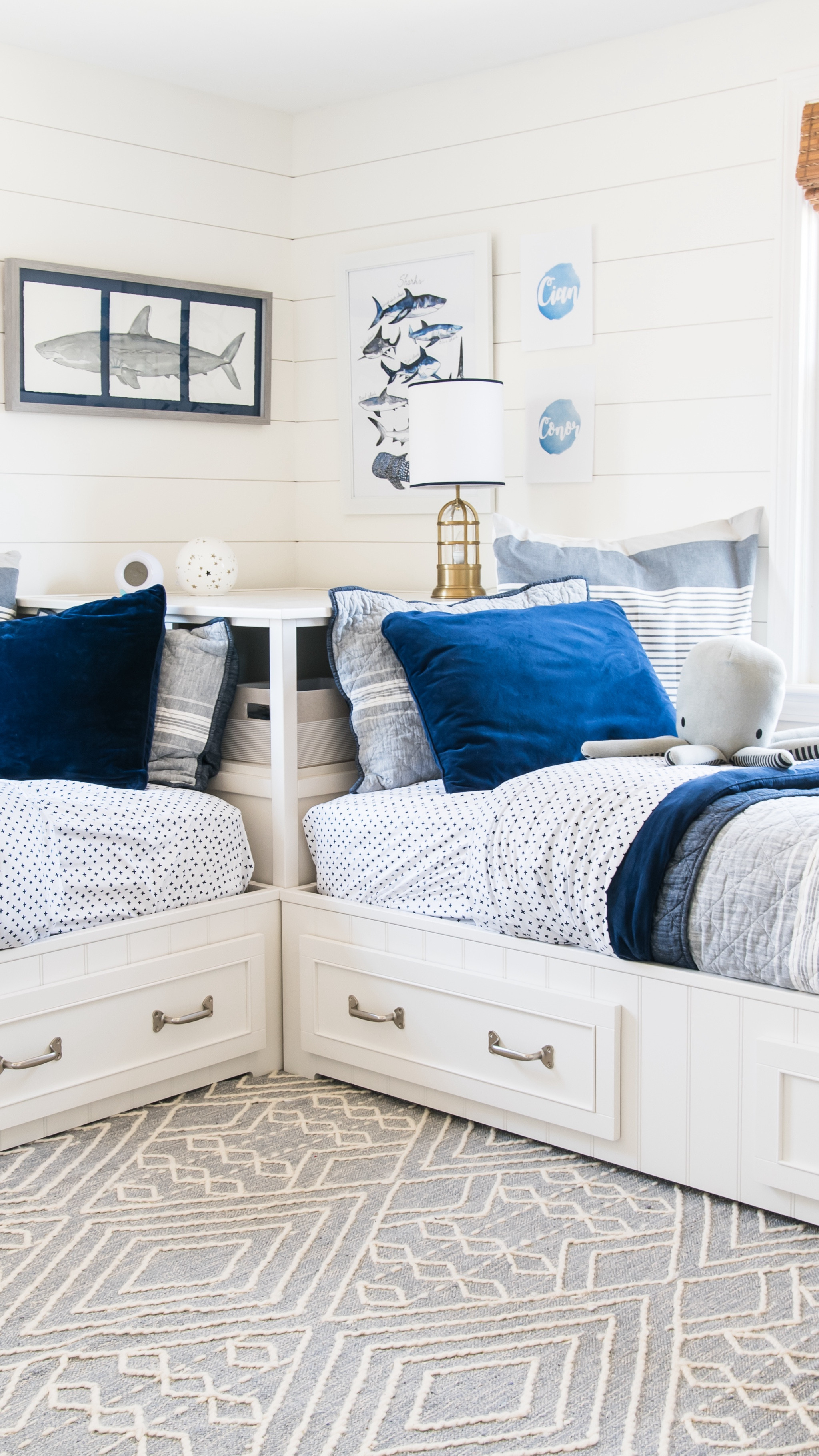 Shared boys bedroom with coastal themed, Pottery Barn storage beds, blue and white bedding, nautical themed kids bedroom

#LTKkids #LTKhome #LTKfamily