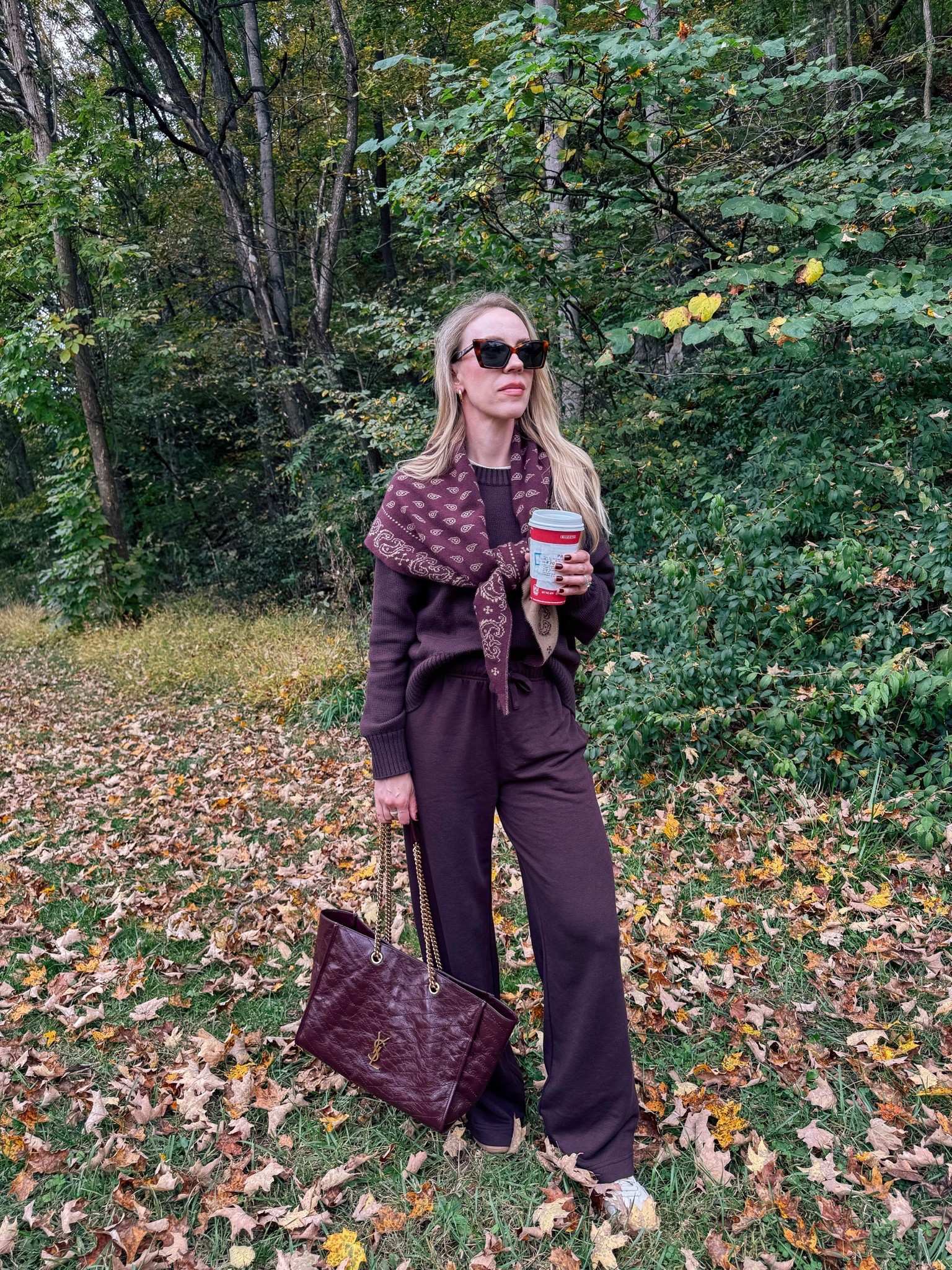 Casual fall weekend travel outfit with @Guest In Residence bandana print scarf, burgundy sweater, burgundy wide leg joggers