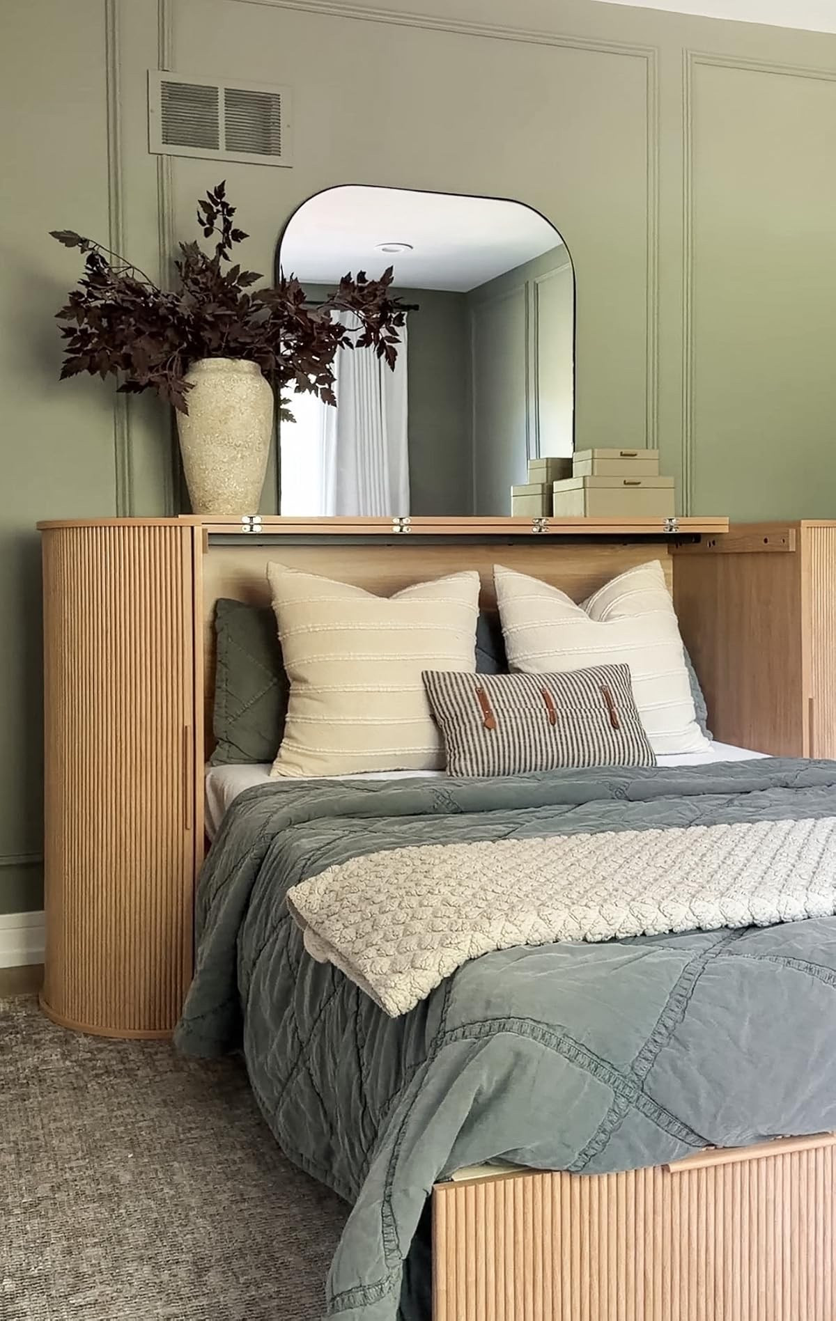 This pullout Murphy bed it looks like a sideboard when not in use and has hidden storage!! The wood color is stunning and it comes in a full-size or queen size. The mattress folds up right inside for easy storage!! This is the full-size!!

#LTKHome
