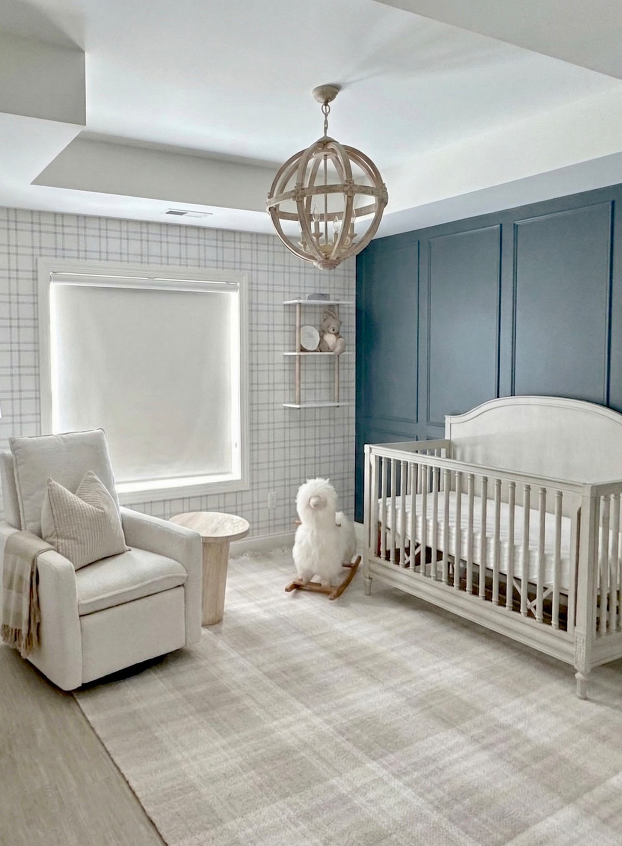 This nursery is coming along! Got this progress photo from the client and I’m so excited to see it when it’s finally done. 

The slate blue molding and plaid wallpaper are up, the soft neutral furniture is in, and the chandelier looks fantastic!

We’ll be finishing off this nursery design with drapery, an accent rug, ottoman, artwork, and more decor. Check back to see the finished space!

Design by @littlecrowninteriors
Photo sent in by client

#LTKBump #LTKHome #LTKBaby