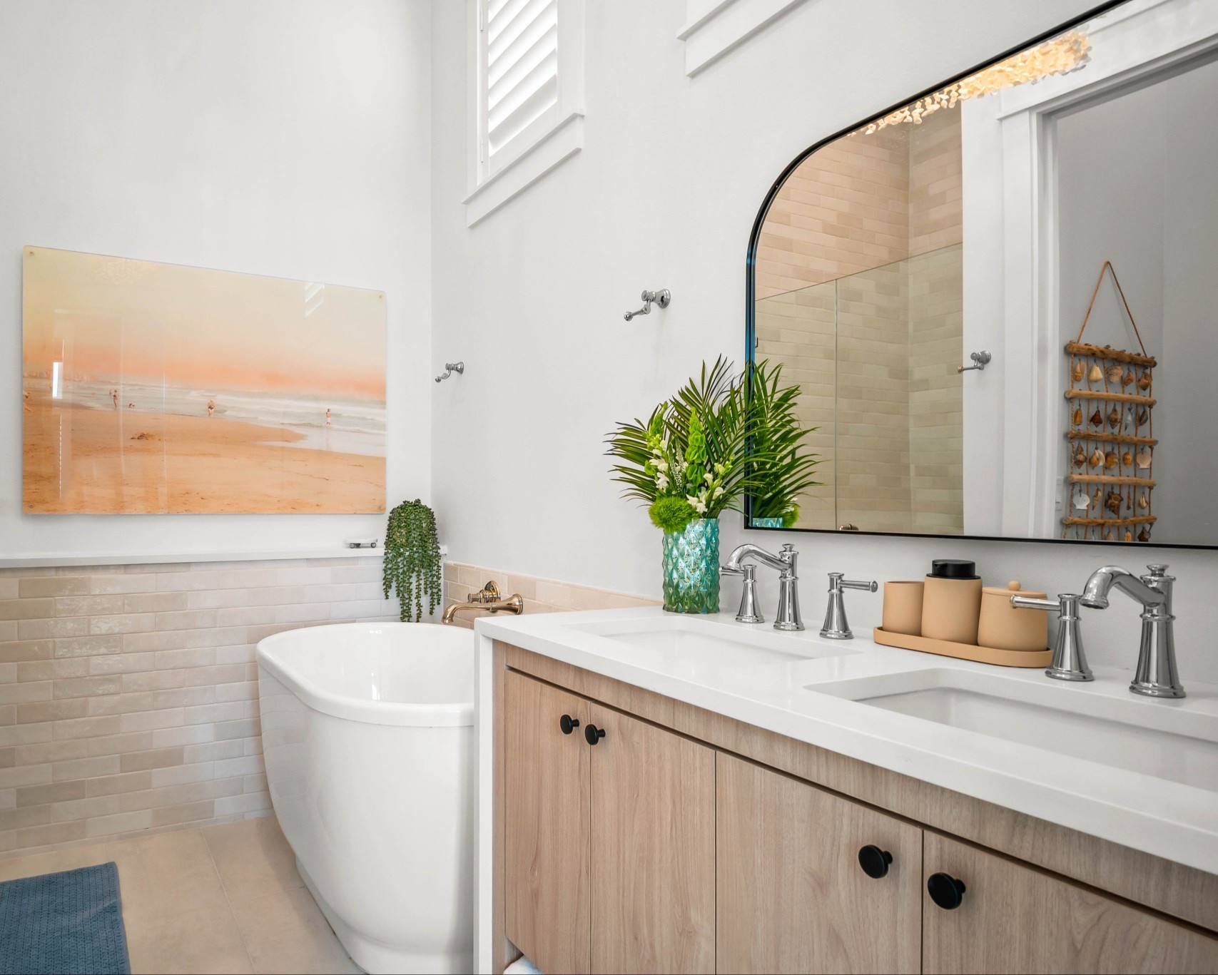 The ultimate after-beach bath, right in the primary suite. 🐚 Rinse off the salt, sink into the bubbles, and let the coastal art on the walls take you straight back to the shoreline. We are obsessed with the final look of this bathroom! 🌴

#bathroomm

#LTKHome