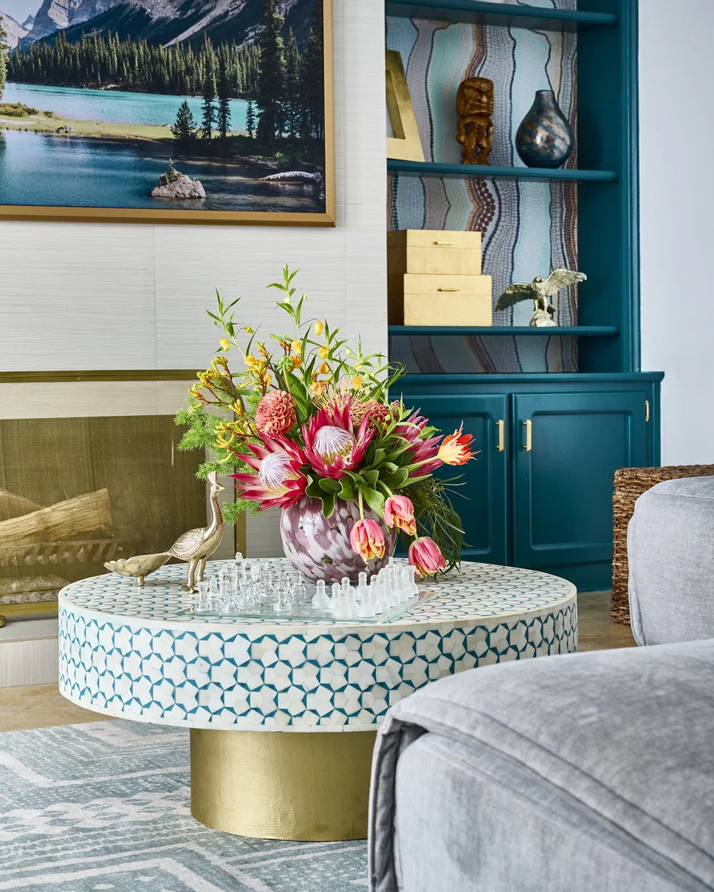 Tips Thursday ✨ | Mixing Bold Color in a Living Room

Bold color doesn’t have to overwhelm a shared space. In this living room, color is layered thoughtfully — deep teal cabinetry grounds the room, artwork and accessories add movement, and softer upholstery keeps everything feeling relaxed and livable.

Our approach to bold color always comes back to balance:
• Anchor the room with one saturated tone
• Repeat color in small, intentional moments
• Let texture and neutrals soften the contrast

The result is a space that feels expressive, welcoming, and timeless — not trendy. Swipe to see how this plays out in Project Birds of Paradise.

#TipsThursday #LivingRoomDesign #InteriorDesignTips #BoldColorInteriors #ColorfulLivingRoom #LayeredInteriors #LTKHome #ShopTheLook #BlessedLittleBungalow #BLBStyle 

 #LTKHome