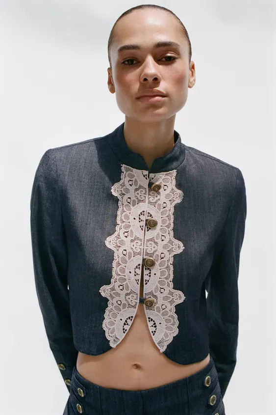 Cropped jacket with a high neck and long sleeves with shoulder pads, finished with buttons. Featu... | Zara IT