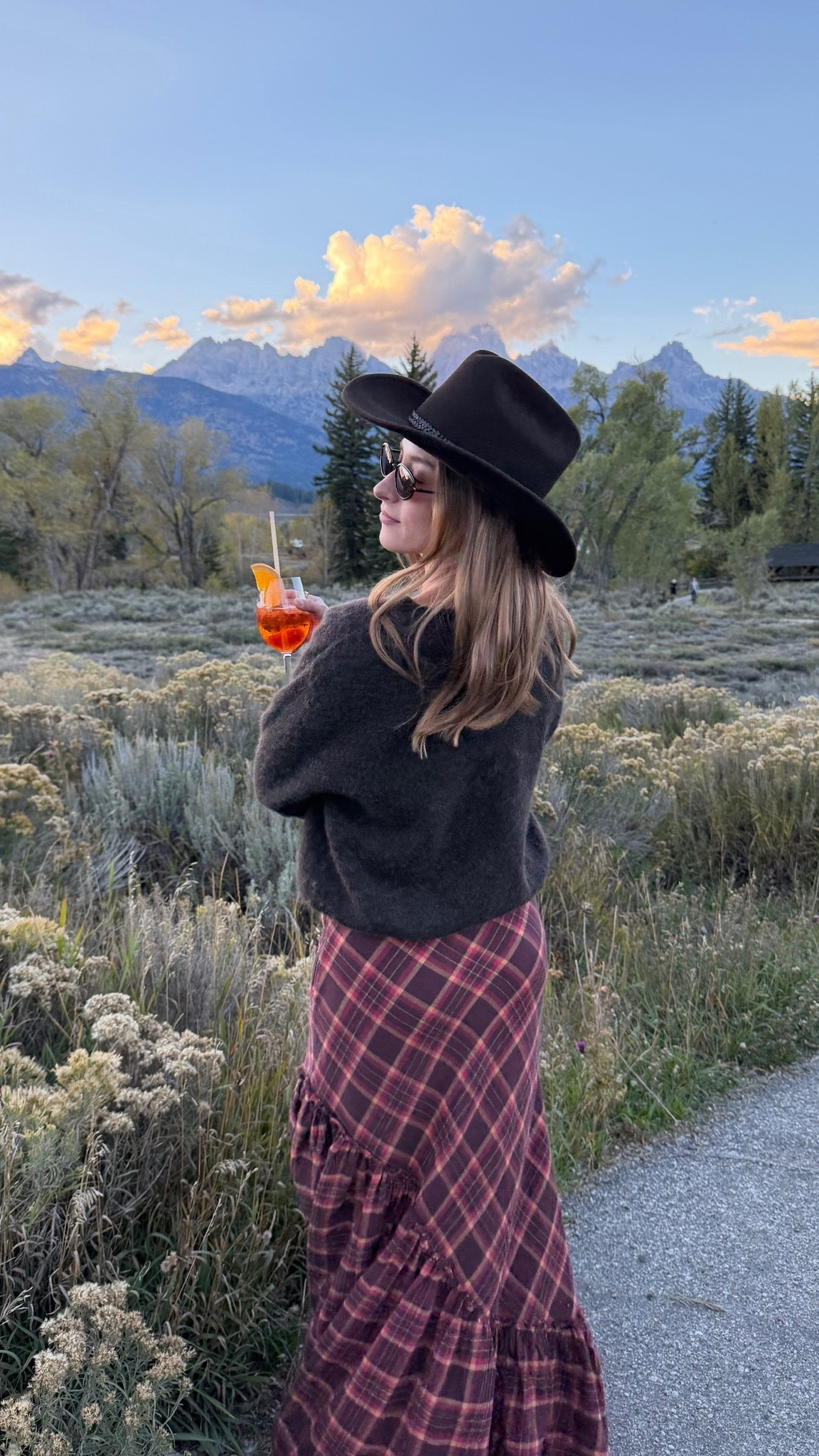 9/28/26 Jackson Hole Welcome Party Outfit 🤠

Leaning all the way into the western dress code for welcome party drinks overlooking the Tetons 🤠🏔️ Linking my Tecovas boots, Free People skirt (size 0), Amazon sunglasses + Overland hat.
My sweater is from American Vintage and unfortunately isn’t linkable, but I’ll add something similar if I can. One of my favorite looks from the entire Jackson Hole trip 🤎

#LTKootd #LTKSeasonal #LTKTravel