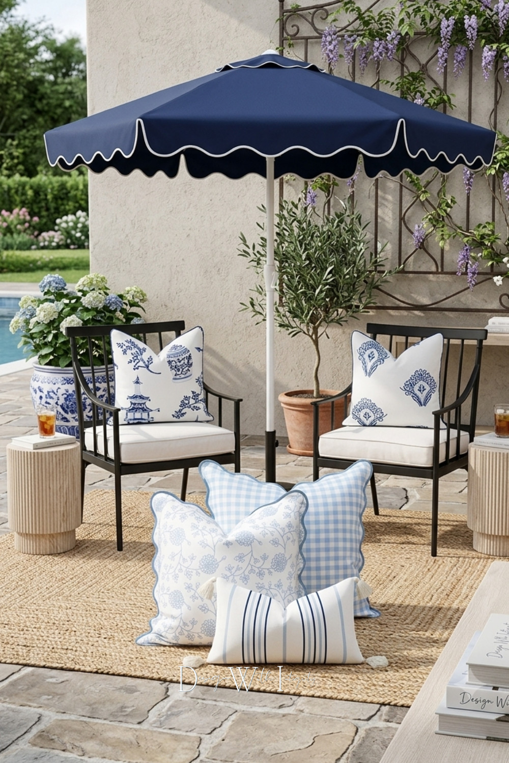 Classic blue and white never goes out of style, especially outdoors.

There is something timeless about the combination of crisp navy, soft sky blue, and warm natural textures. This patio design layers black framed lounge chairs with ivory cushions, a woven natural fiber rug, sculptural fluted accent tables, and a navy scalloped market umbrella to create an outdoor space that feels equal parts polished and inviting.

The pillow mix brings the entire palette to life with chinoiserie inspired prints, delicate botanical motifs, classic gingham, and tailored blue stripes. Terracotta planters, an olive tree, blooming hydrangeas, and climbing wisteria soften the architectural lines and create the feeling of a secluded garden retreat designed for slow mornings, afternoon reading, and long conversations outdoors.

If you're looking to refresh your own patio, start with timeless foundational furniture, layer in natural textures, and finish with textiles that tell a cohesive story.

Shop the Look on LTK to recreate this curated outdoor space in your own backyard.

This design began as one of my digital mood board concepts and was later transformed into an AI generated visualization to help homeowners see how carefully sourced products work together in a realistic outdoor setting.

#PatioDecor #OutdoorLiving #LTKHome 

 #LTKSeasonal #LTKHome