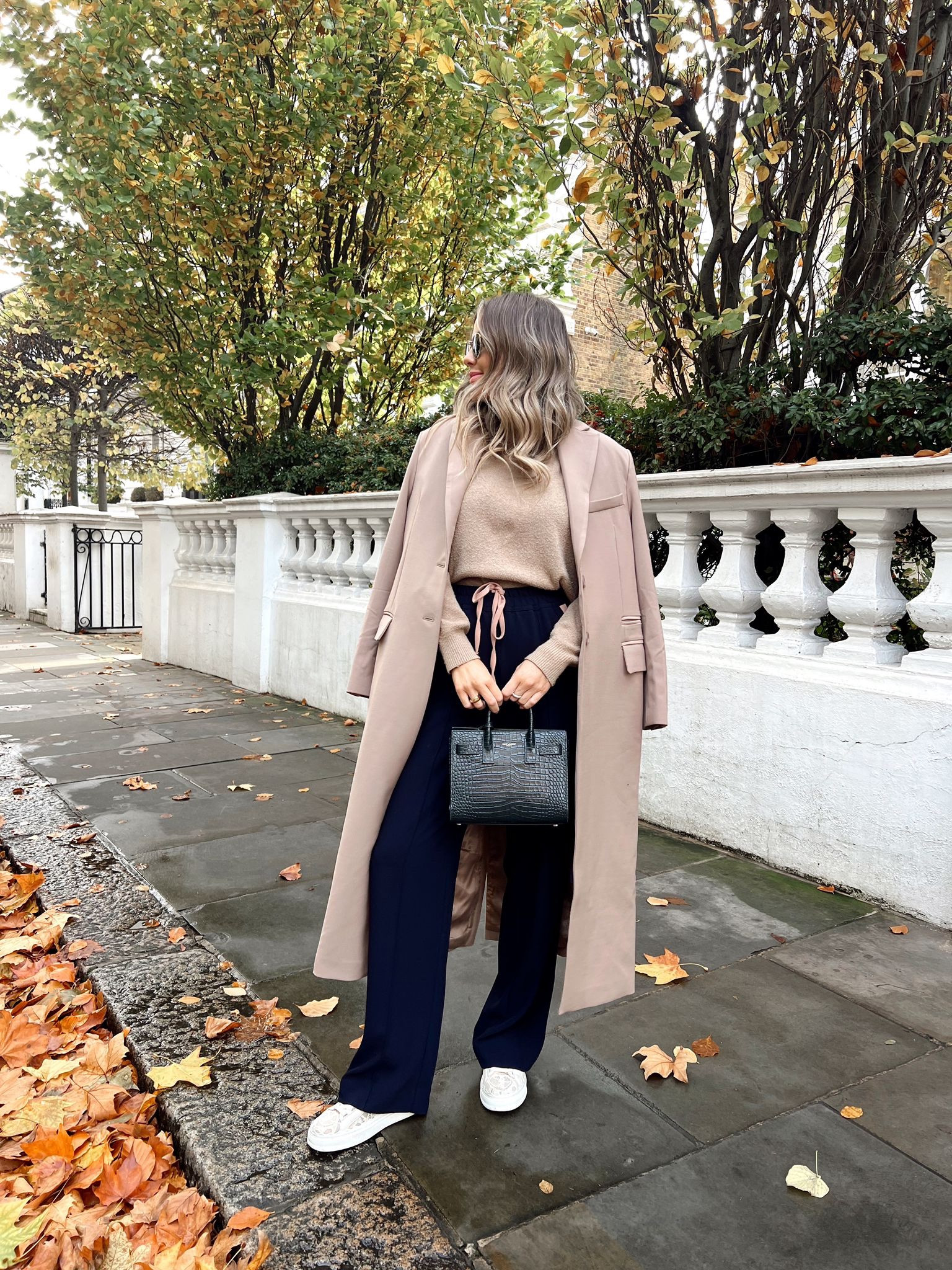 Autumnal outfit for chilly days in the city. Taupe brown mock neck jumper & tailored coat (from BOA). Black & camel striped trousers from Reiss, YSL sac du jour, Chloe Lauren lace trainers & rayban round sunnies  

#LTKsalealert #LTKCyberweek #LTKstyletip