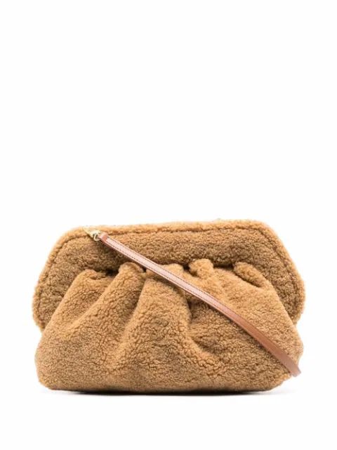 Teddy clutch bag | Farfetch (UK)