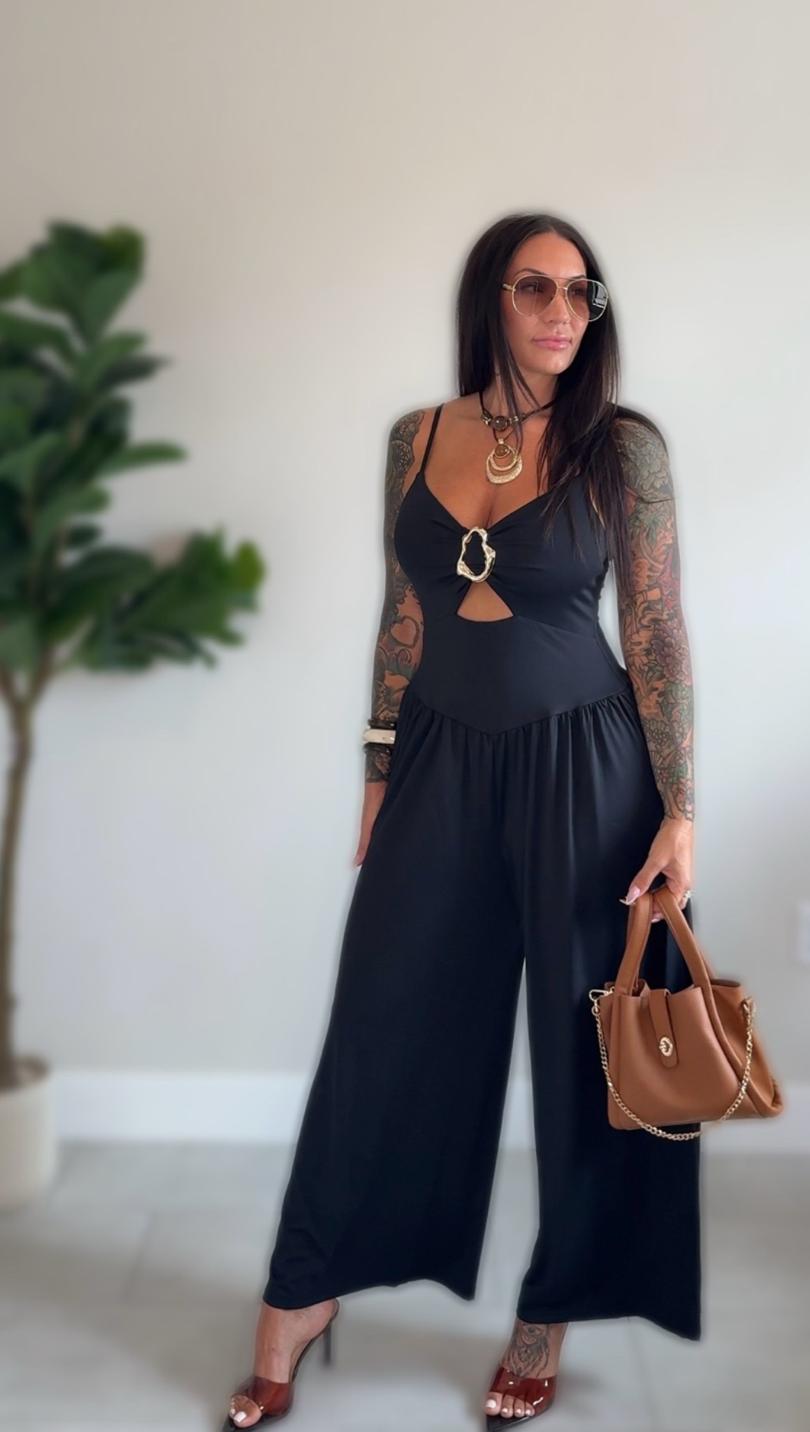 This jumpsuit doesn’t even need much because it has a large gold embellishment in the center. Add a necklace and some kitten heels and you’re ready to go!

#LTKgrwm #LTKootd