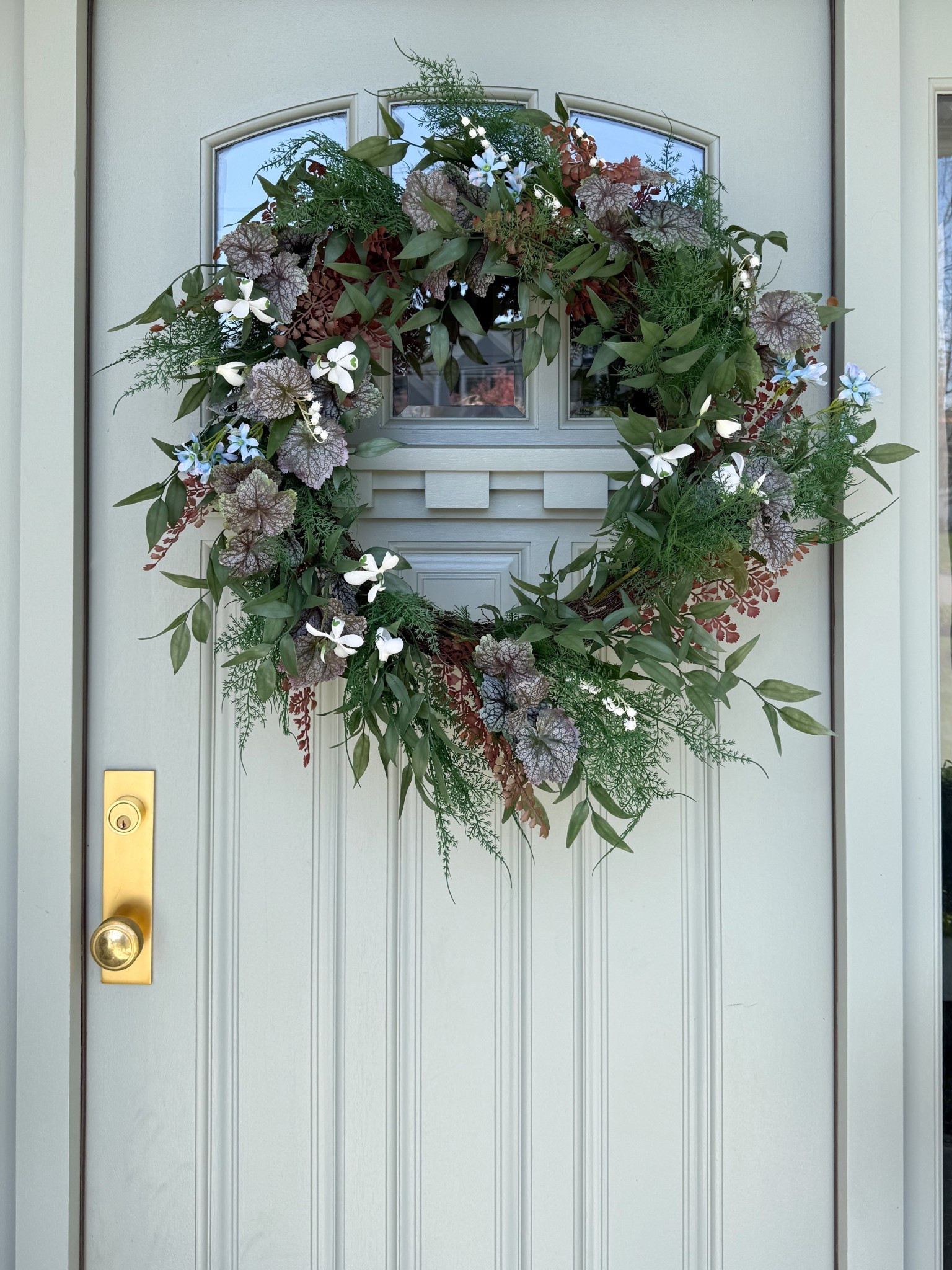 This wreath brings in so much depth with a mix of greenery, soft florals, and muted tones that feel natural and layered. It stands out beautifully against the painted door and creates a focal point that instantly elevates the entire entry. Such an easy way to add texture and interest without needing additional decor.

front door wreath ideas, greenery wreath decor, spring wreath front door, neutral front porch decor, floral wreath styling, entryway curb appeal, outdoor door decor ideas, seasonal wreath inspiration, classic front door styling, welcoming entry decor, front porch ideas girlonthehudson

#LTKHome #LTKSeasonal