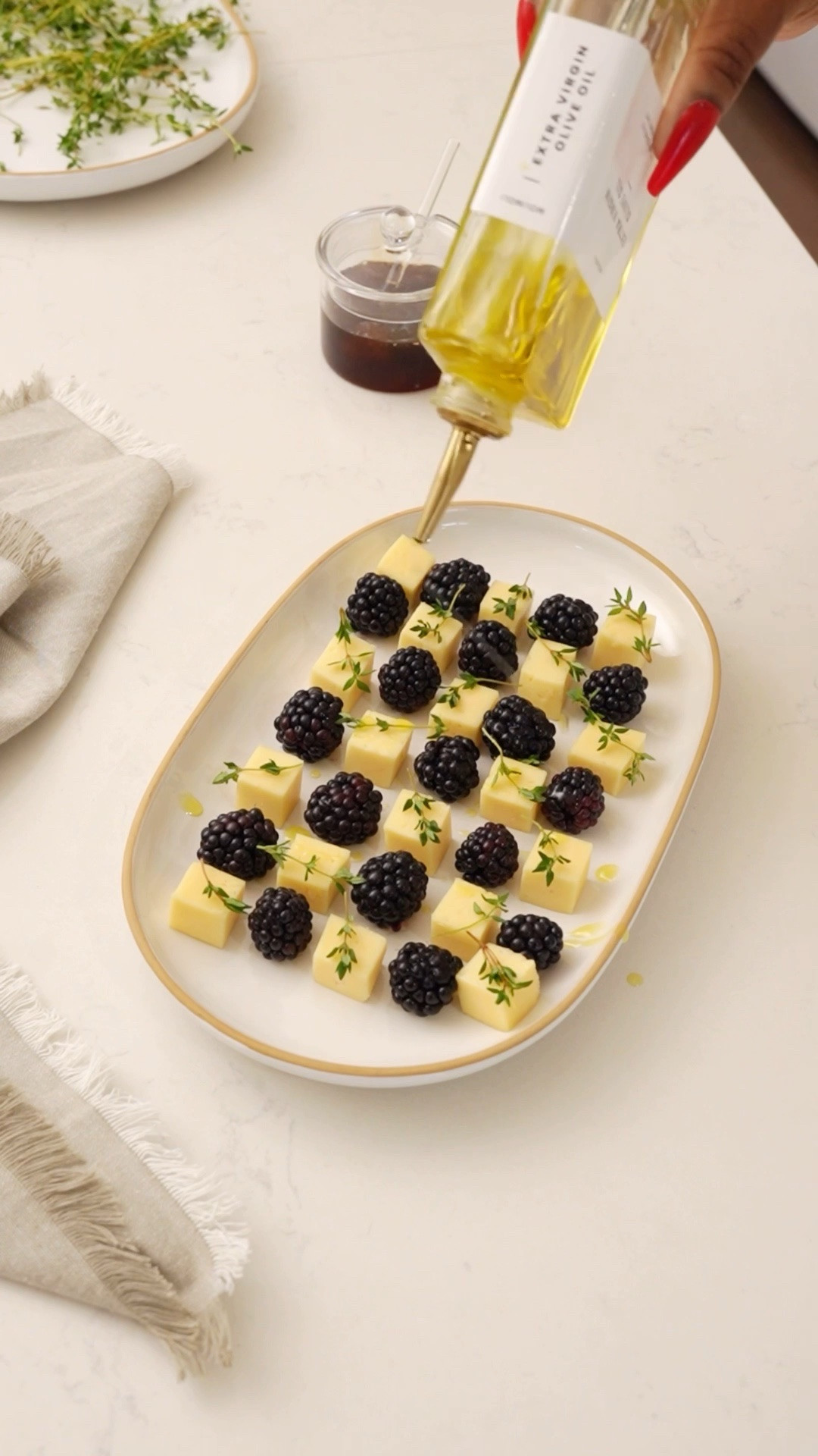 Blackberry and Cheese Checkerboard
What you need:
• Blackberry
• Brie or Swiss cheese
• Thyme
• Olive oil
• Honey
hosting ideas, charcuterie boards, simple recipes, appetizer ideas
pinterest inspired, aesthetic appetizer, easy hosting ideas, cheese board, summer dinner parties

#LTKSeasonal #LTKdayinmylife #LTKfoodie
