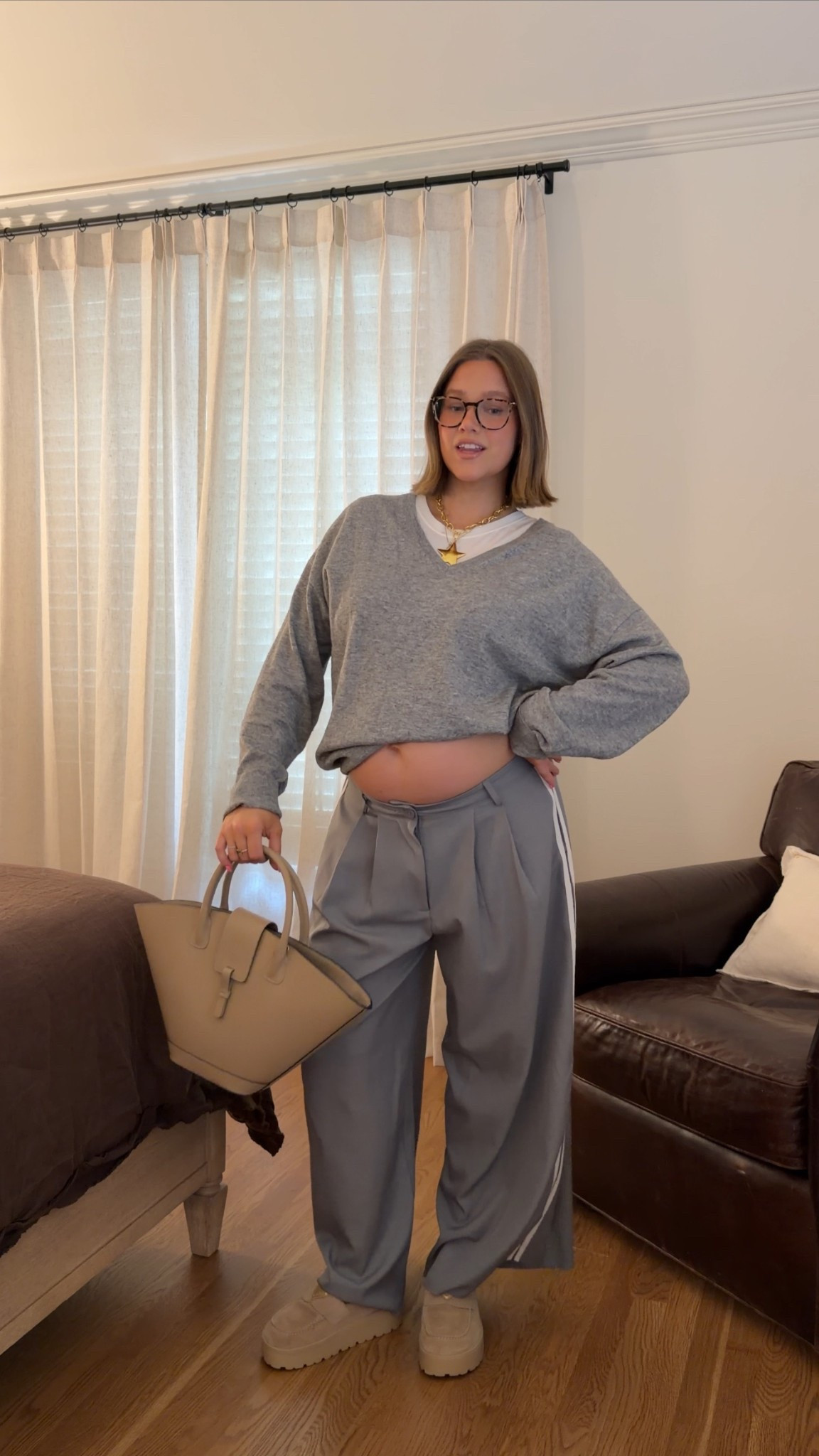 Linked similar sweater. Lioness track pants size L and I cut three inches off the bottom because they were soo long. FP movement tee size L I love the fit. Bracha jewelry. Will link similar bag (this is Paris 64 brand) Prada loafers my go to shoes I wear all the time true to size  