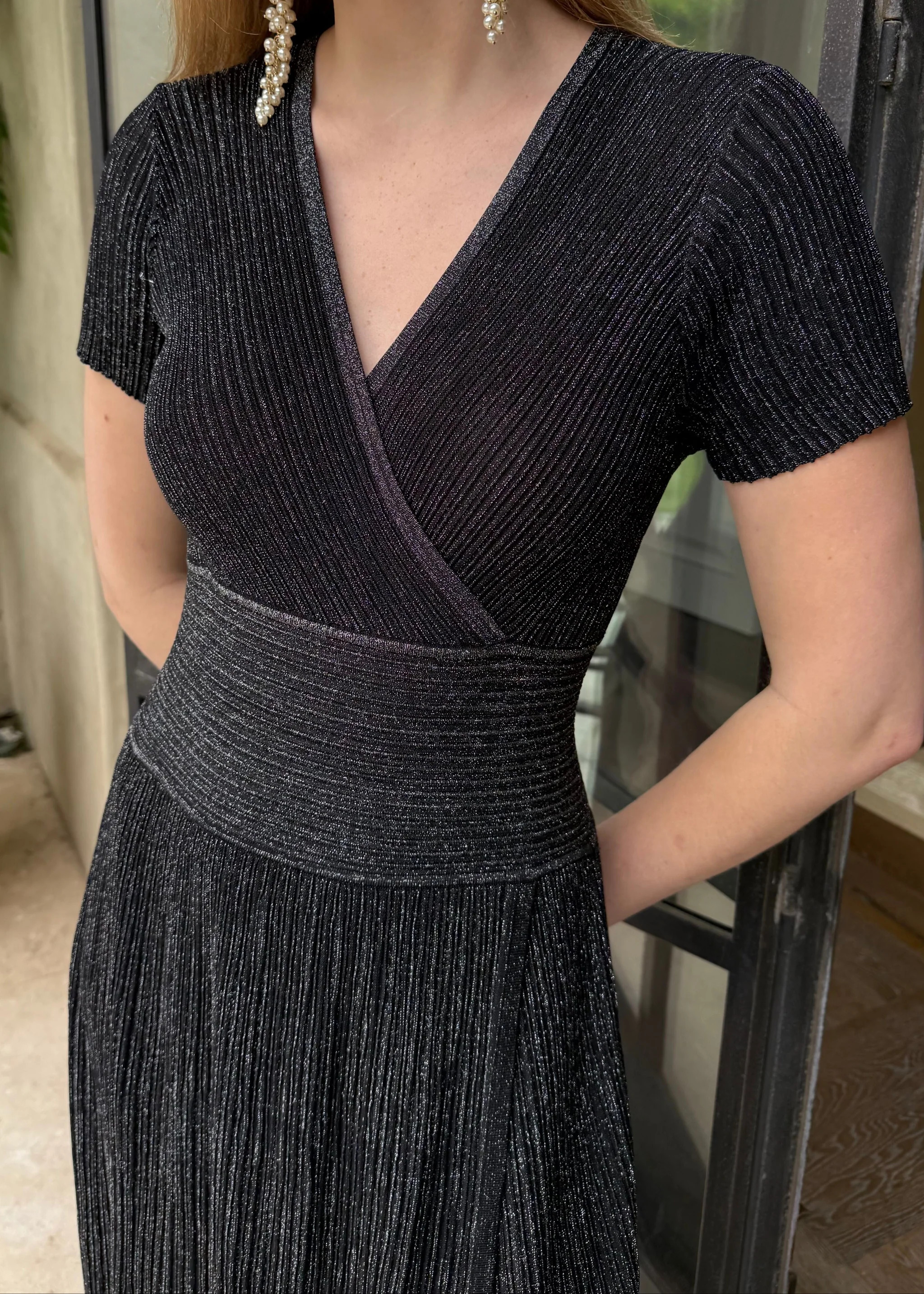 Estelle Shimmering Black Pleated Short Sleeve Midi Dress | Benaar La