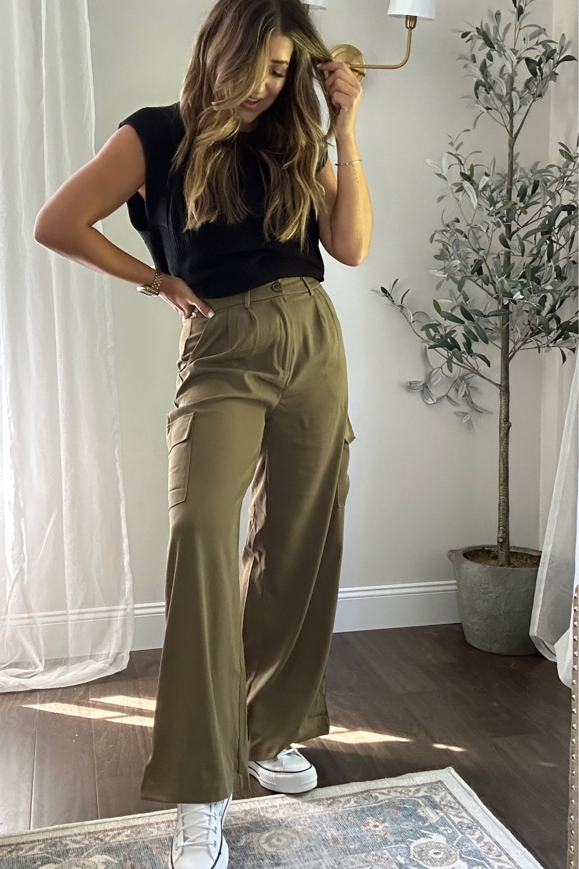 Easy fall outfit. Looooving these wide leg green cargo pants with converse. Wearing a medium.

#LTKstyletip #LTKshoecrush #LTKSeasonal
