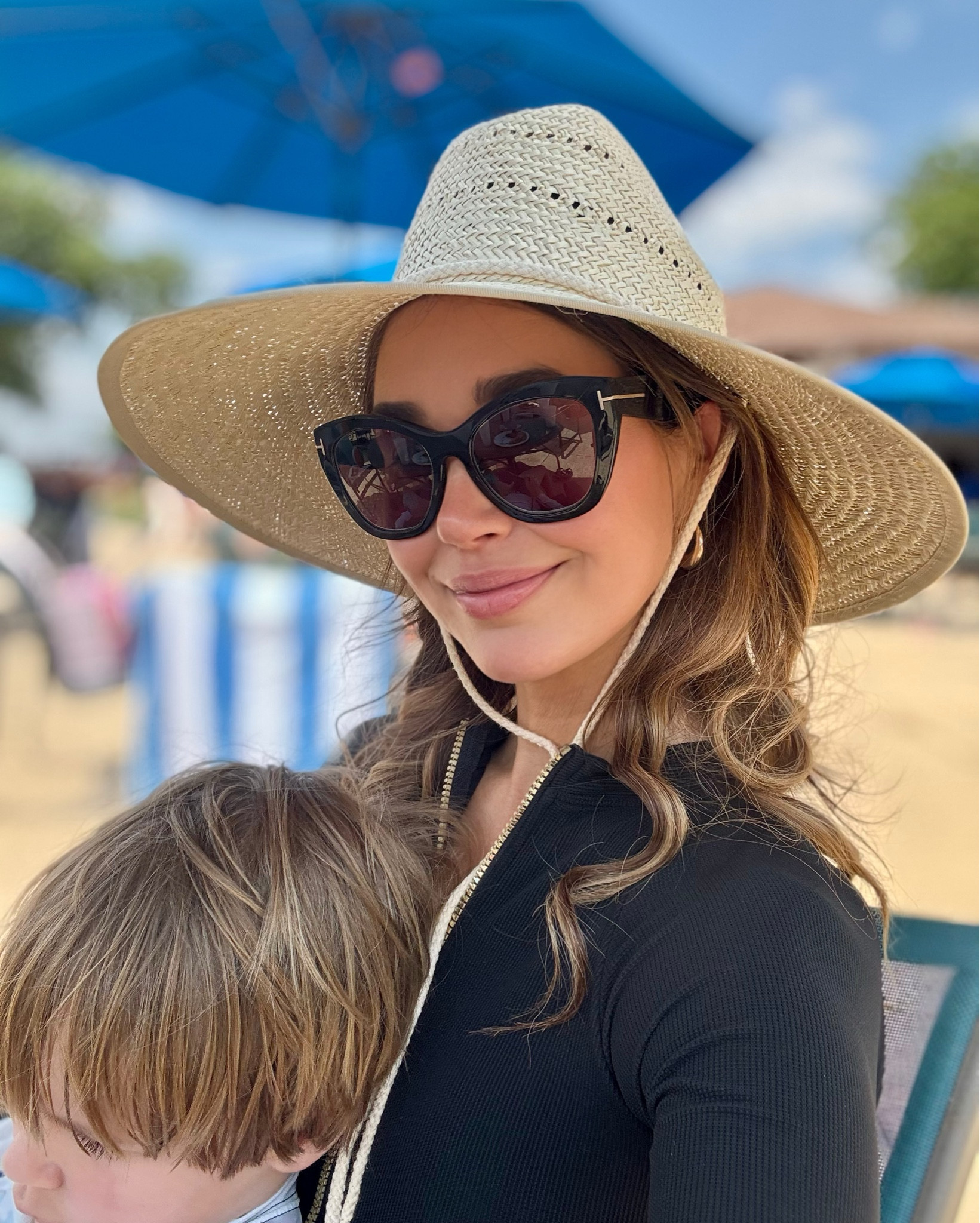 I have become a convert to hats with chin straps…no more holding your hat on the beach or during a windy day at the pool! What have I been missing all these years?! 😂 (If you spend any time on a boat during the summer, I’m guessing you already know this is the way to go!)

This hat from Lack of Color is stylish, comfortable, and lightweight. I first saw it at Tuckernuck, where it quickly sold out, but it’s still available from a few different retailers. 

Also tagged my suit from Lilly Pulitzer. It’s sold out in the solid colors, but still available in a few patterns and colors.  (Ladies, we need to cover our backs! It’s one of the spots most likely for skin cancer to go unnoticed and sun damage to accumulate.)#LTKSummerEdit 

#LTKSwim #LTKSeasonal