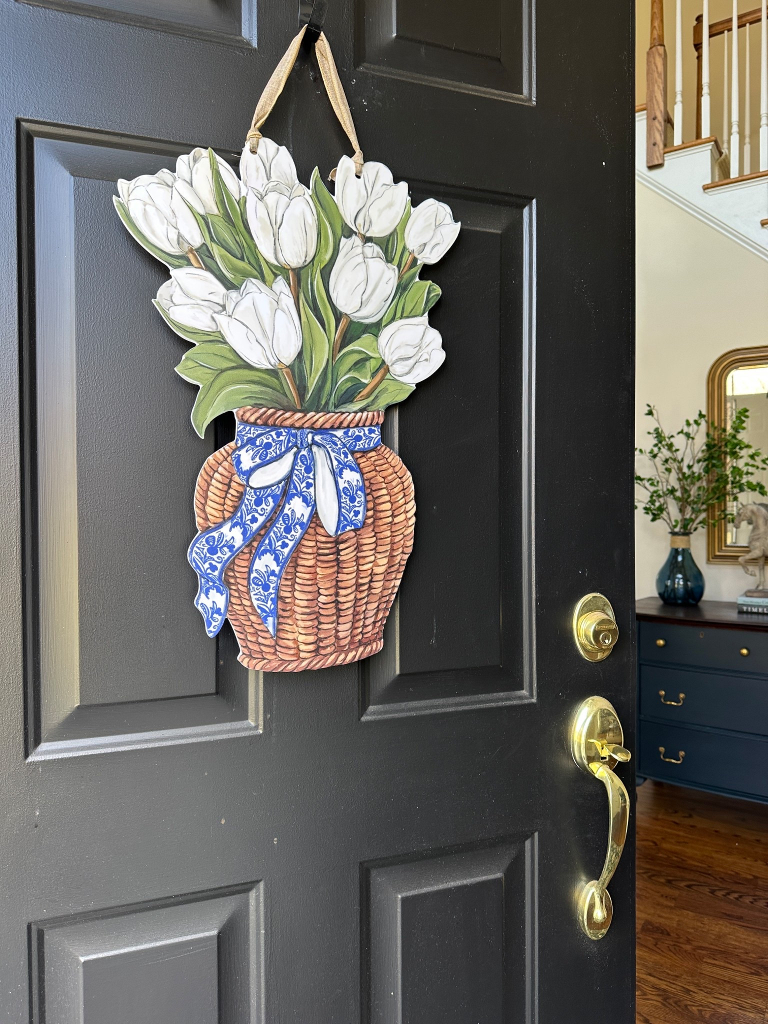 Spring door decor instead of a spring wreath (that the birds might nest in).  A pretty tulip door hanger to display for Easter and beyond!

#ltkspring 

#LTKHome #LTKSeasonal