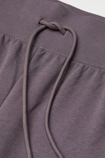 Lightweight sweatpant joggers made from a cotton blend. Covered, elasticized waistband with draws... | H&M (US)