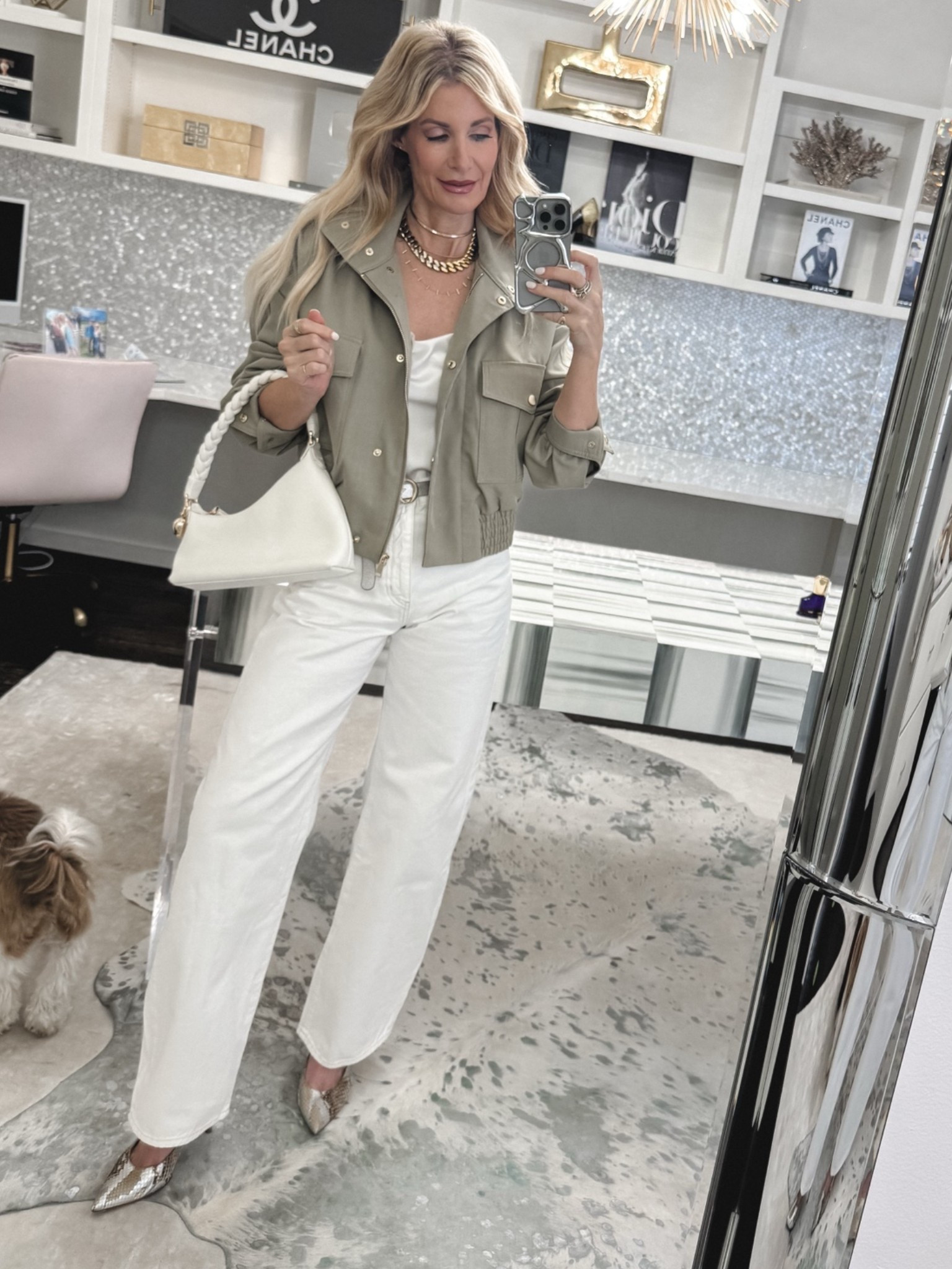 These white FRAME jeans are that good 🤍 The relaxed wide leg fit with the subtle tapered ankle gives them such a modern, elevated feel ✨ Styled with this gorgeous bomber jacket with champagne gold hardware, it’s the perfect polished weekend outfit. I’m wearing a 23 in the jeans and recommend sizing down since they run big 

 #LTKootd #LTKSeasonal #LTKOver40