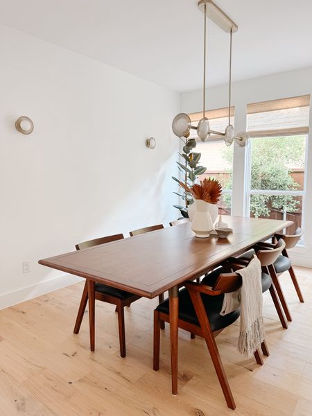 Formal dining room styling

Love our modern lights / modern dining table / modern dining chair / organic modern decor / white vase /

#LTKHome #LTKStyleTip