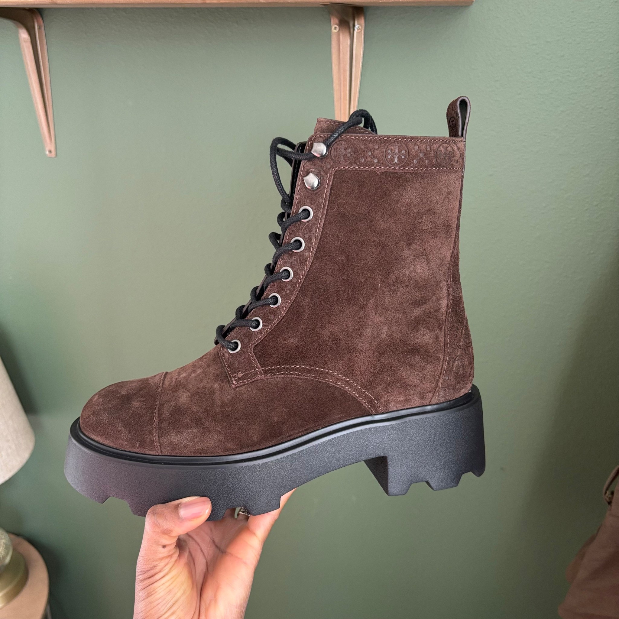 Super cute combat boot! I would definitely order a half size up for toe and thick sock space! 