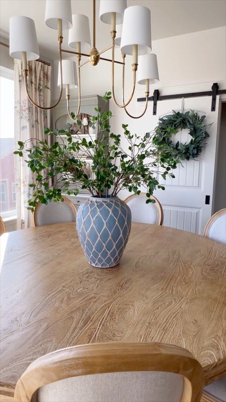Super easy spring greens display. These viral green branch stems are really so good. I have 2 bunches displayed here because my vase pot is so big. Love how tall the stems are and you can easily bend them or clip them to make them fit shorter vases.

Spring decor. Faux florals. Round dining table, grandmillenial, unlacquered brass chandelier, visual comfort, floral curtains, Ballard designs

#LTKhome