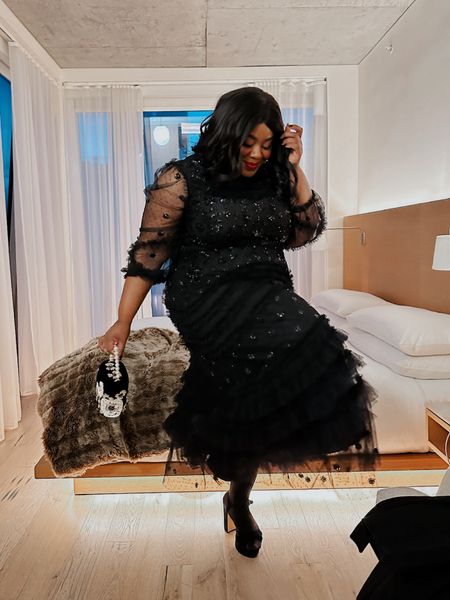 Black Swan — this picture doesn’t do this dress justice. It’s a maximist dream. Tulle, sequins and ruffles oh my!  

I wore this out to a Broadway show earlier this month and it was the perfect. Wearing a 3X. 

#plussizespecialoccasion #plussizefashiom #plussizeweddingguestdress 

#LTKplussize #LTKHoliday #LTKSeasonal