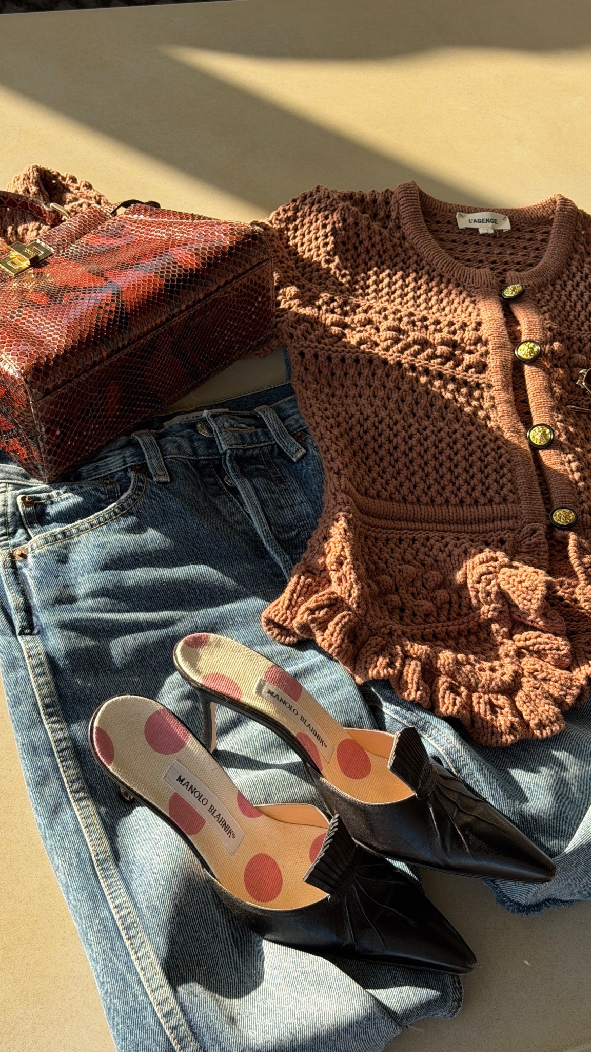 It’s all about the details, dahling 💋 Pumpkin spice crocheted sweater is by L’Agence, straight leg denim is Re/Done, python bag is Fendi, and black mules are Manolo Blahnik. Linked exacts and similar!

#LTKItBag #LTKSeasonal #LTKStyleTip
