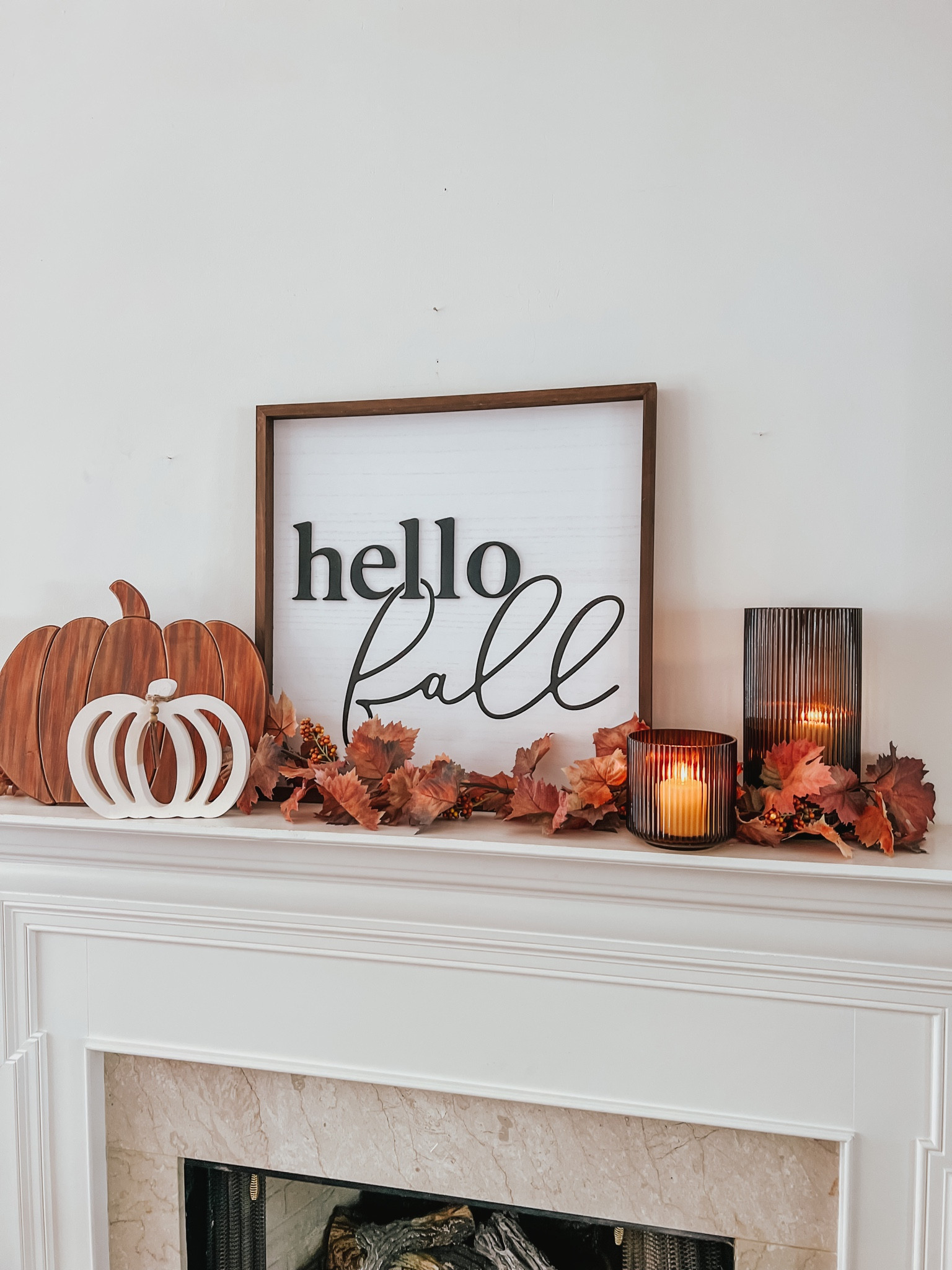 Simple fall mantel 


Hello Fall | wood sign | pumpkin decor | candles | leaves 


#LTKSeasonal #LTKhome