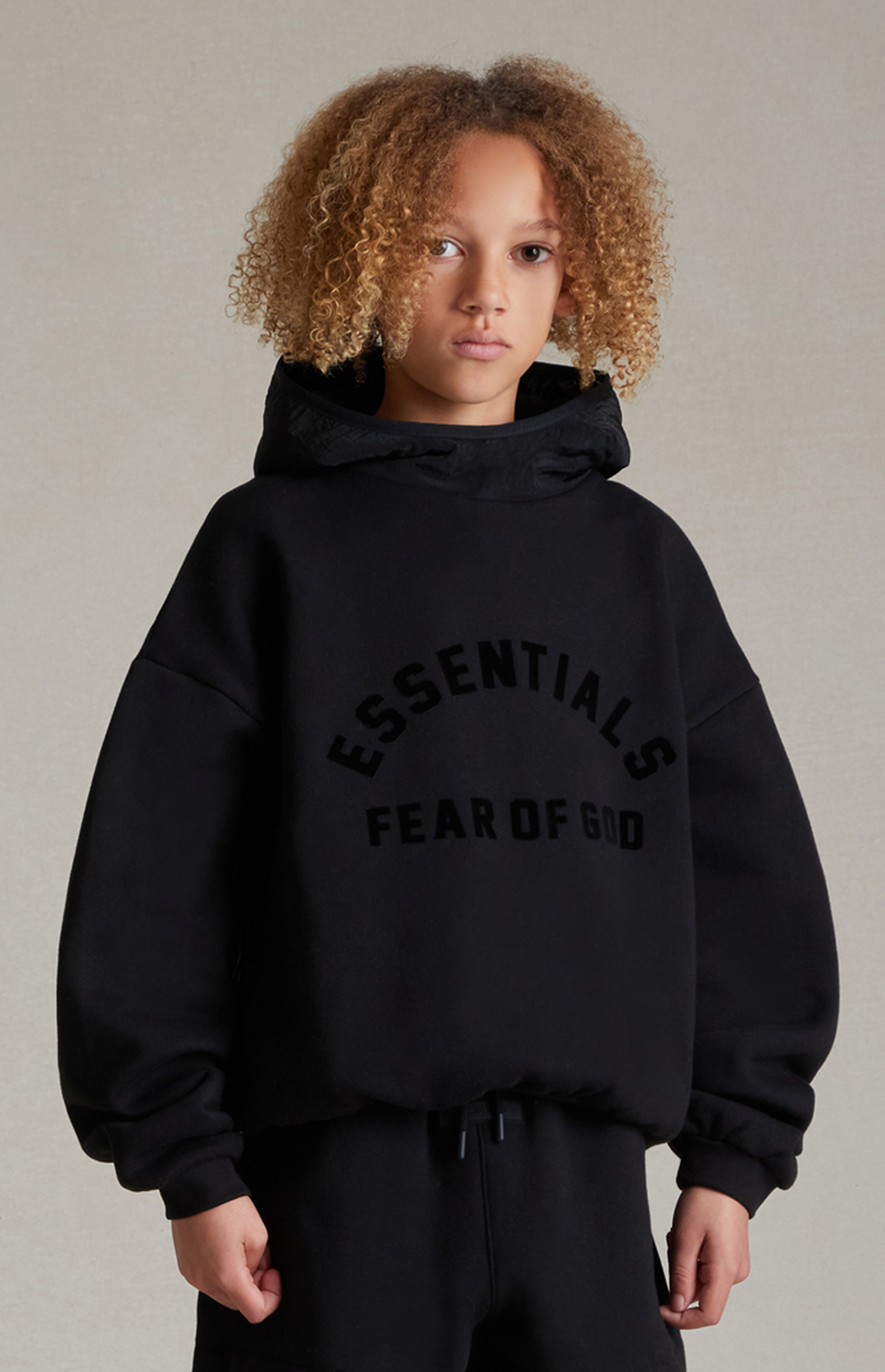 Fear of God Essentials Essentials Jet Black Nylon Fleece Hoodie | PacSun