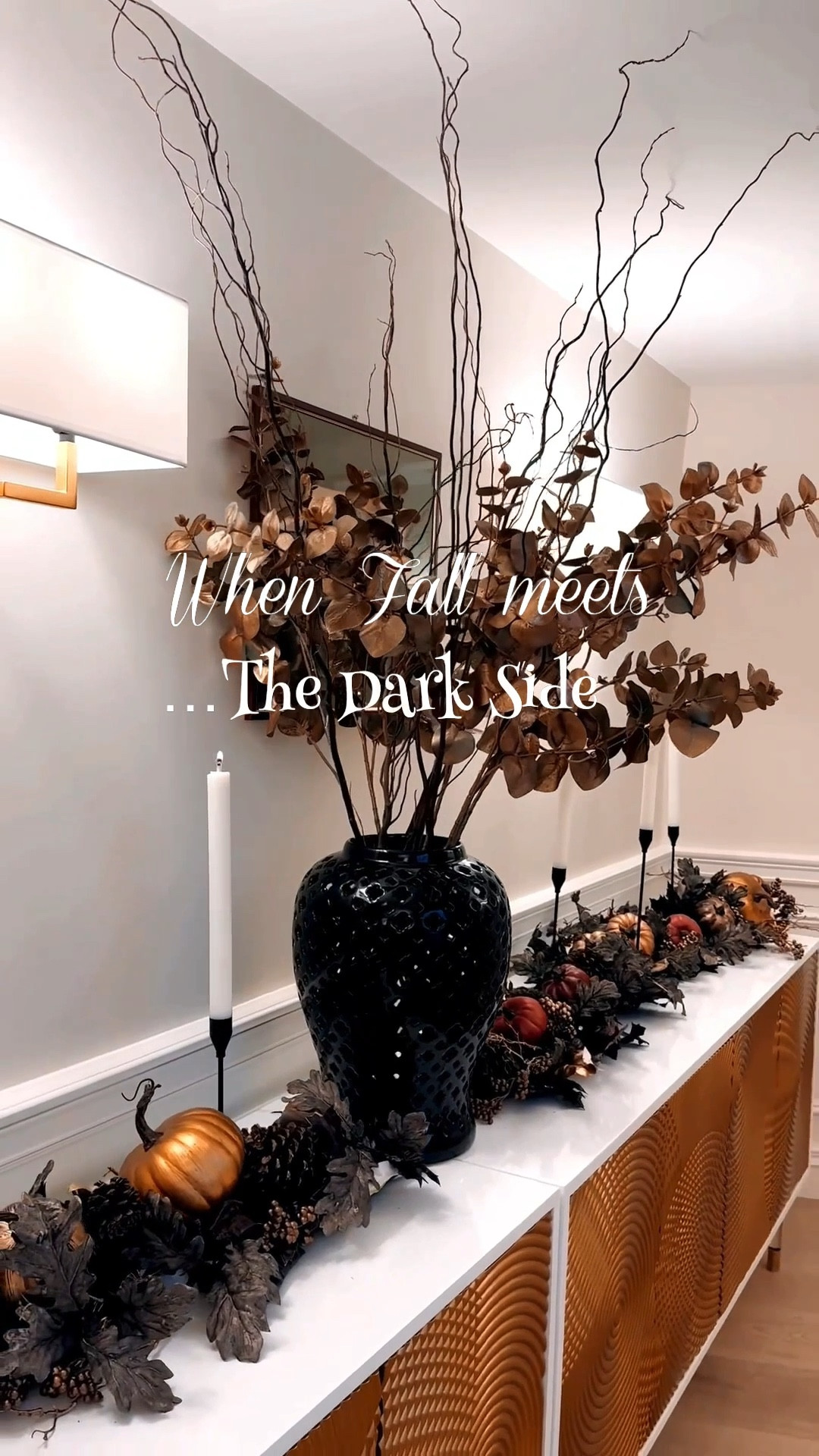 SALE ALERT! 50% OFF 
Because spooky doesn’t have to mean scary.
As usual, I wanted to create something that felt more “grown-up Halloween” than “party store fright.” I like it to blend with my existing fall décor, keeping the atmosphere cohesive and elegant. I used a “falloween” garland to bring in those autumnal tones—dark leaves, pinecones, and touches of moody fruit—then added white candles on black candleholders for contrast. I added glittered eucalyptus stems and bare twigs in a large black ginger jar complete the look—just enough drama to whisper mystery, without losing an ounce of design sophistication.
It’s the perfect balance of fall and fantasy—a little mysterious, entirely elegant. 💫 

#LTKSeasonal #LTKFindsUnder100 #LTKHalloween