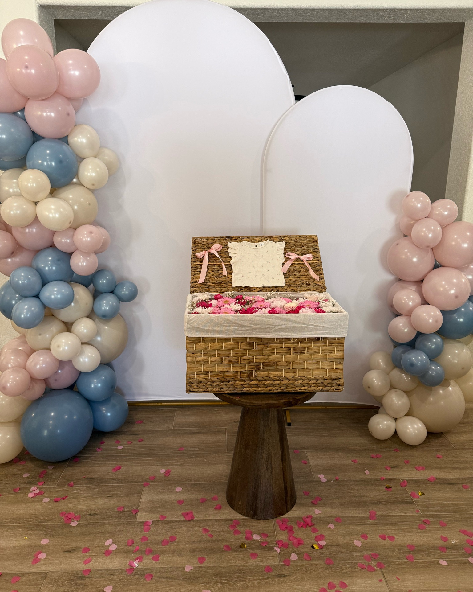 Gender reveal flower basket!  What a cute way to reveal our baby’s gender to our family and friends 💕

I used this hyacinth basket with a lid and filled it with flowers by using plastic containers with wet floral foam. The key is to make sure the flowers are sitting just below the basket edge so the lid can fully close. 

I decided to also add some bows and baby girl shirt to the under side of the lid and I just secured those with safety pins into the basket (without hooking) 
•
•
Gender reveal, gender reveal decor, baby party, party decor, balloon arch, dusty pink and blue balloons, gender reveal balloons, gender reveal basket, flower basket, it’s a…, it’s a girl

#LTKBaby #LTKmomlife
