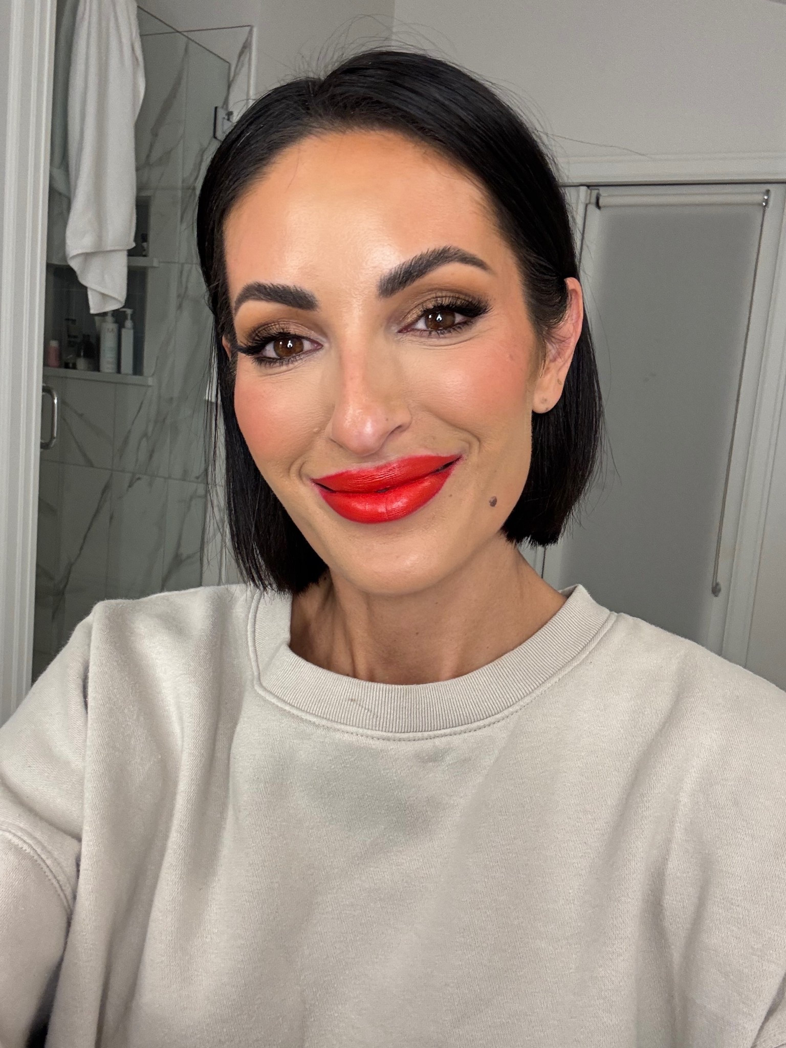 Best Bright Holiday lip! Orangey red - gorgeous on all skin tones. This formulation is creamy and delicious ! I paired w a reddish lip liner  

#LTKgrwm #LTKHoliday