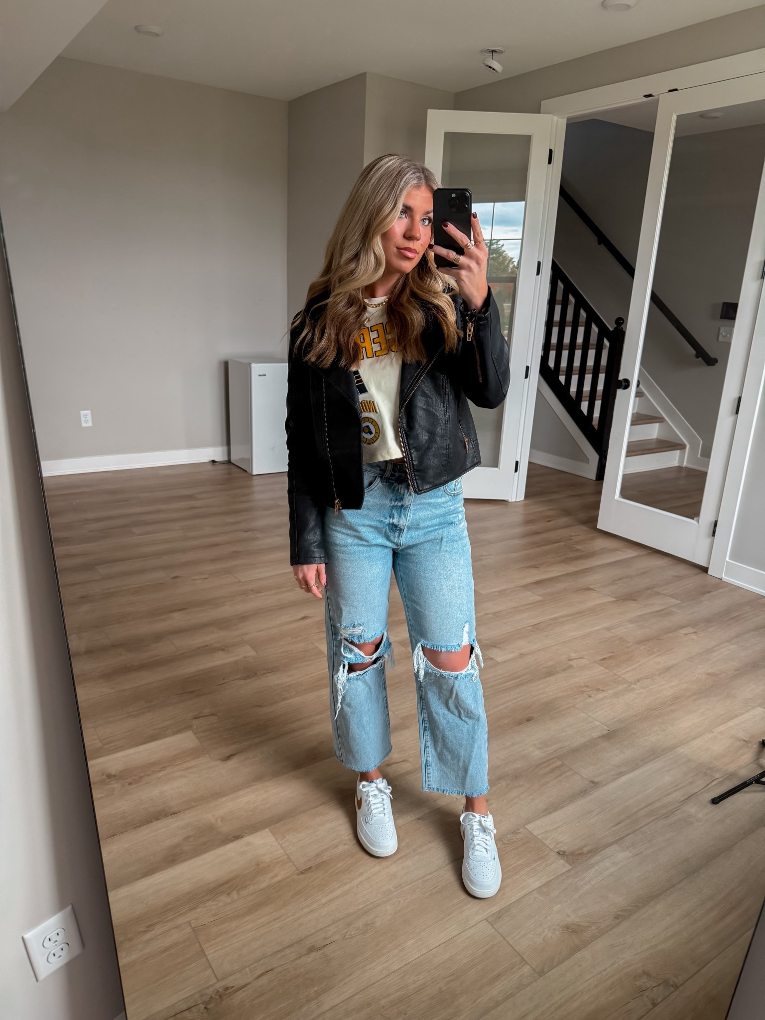 Linking my whole outfit for you all! I do not have an exact link for the black jacket because it is an old one, but I linked a couple similar ones that are from the same brand!
I have a size medium in the shirt and it is true to size. It’s a very nice high-quality NBA shirt. 
I’m wearing a size large in the jeans which I feel like our true size right now! I’m 156 pounds currently at 5’8!
I am normally a size 9 in shoes, and I would say these run just a smidge big.

#LTKStyleTip #LTKShoeCrush #LTKSeasonal