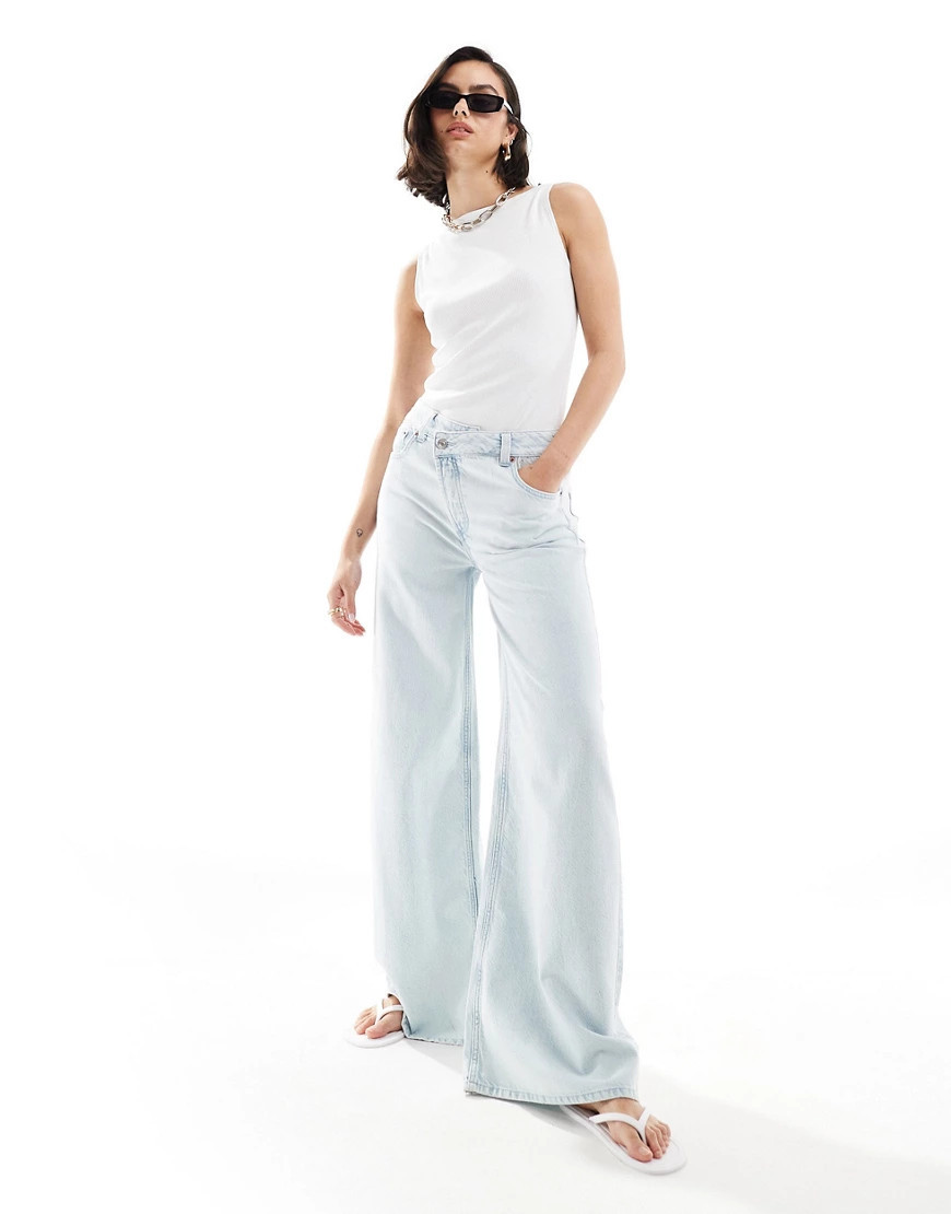 ASOS DESIGN soft wide leg jeans with cross front in light wash-Blue | ASOS (Global)