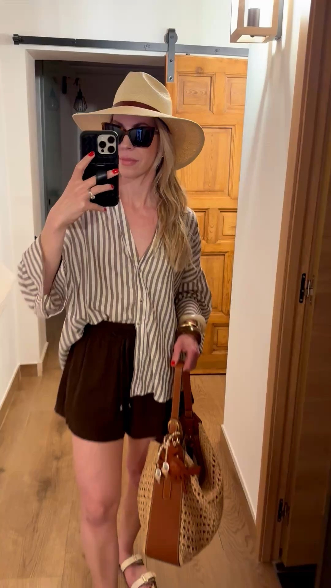 Beach vacation outfit, striped linen shirt, dark brown linen shorts, @Janessa Leone straw hat, straw tote bag, bag charms

#LTKTravel #LTKOver40 #LTKSeasonal