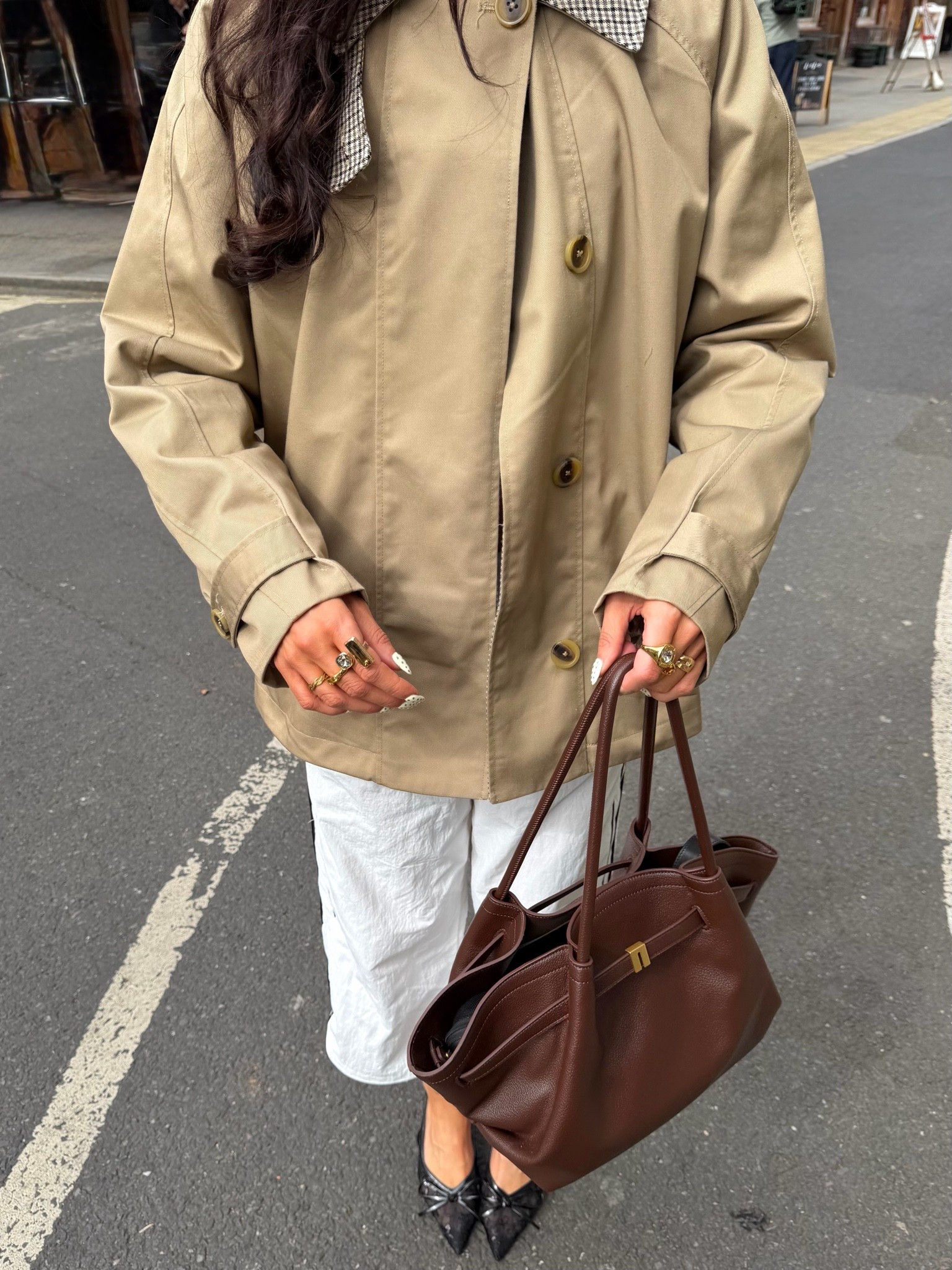 Effortless spring city outfit 🤍 Trench jacket + white capri’s / cropped trackies + chocolate brown bag = the ultimate smart casual look for everyday chic style

This is your go-to spring outfit idea for an elevated everyday look. A lightweight beige trench jacket paired with a white midi skirt creates a clean, timeless base, while a brown leather tote bag adds warmth and a luxury feel. Finished with pointed black flats and gold jewelry for that polished smart casual aesthetic.

Perfect for:

* City outfits / London & Paris style
* Spring transitional outfits
* Casual chic everyday wear
* Work to weekend outfits
* Minimal neutral wardrobe lovers

Key pieces trending right now:
trench coats, neutral outfits, brown accessories, quiet luxury style, capsule wardrobe staples

⸻
#springoutfit #springstyle #casualchic #smartcasual #cityoutfit #londonstyle #parisianstyle #minimalstyle #neutraloutfit #trenchcoatstyle #everydayoutfit #capsulewardrobe #effortlessstyle #quietluxury #ltkstyle #ltkfashion #ltkeurope #ltkspring #outfitinspo #whiteskirt #brownbag #classicstyle

#LTKuk #LTKstyletip #LTKgiftguide