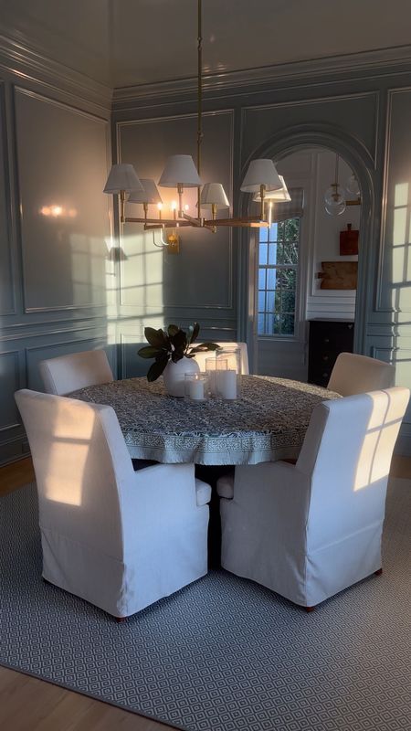 Our dining room with the modern farmhouse table and upholstered dining chair with Larkspur chandelier. Color is BM Slate Blue

Threshold pottery barn serena and lily amazon