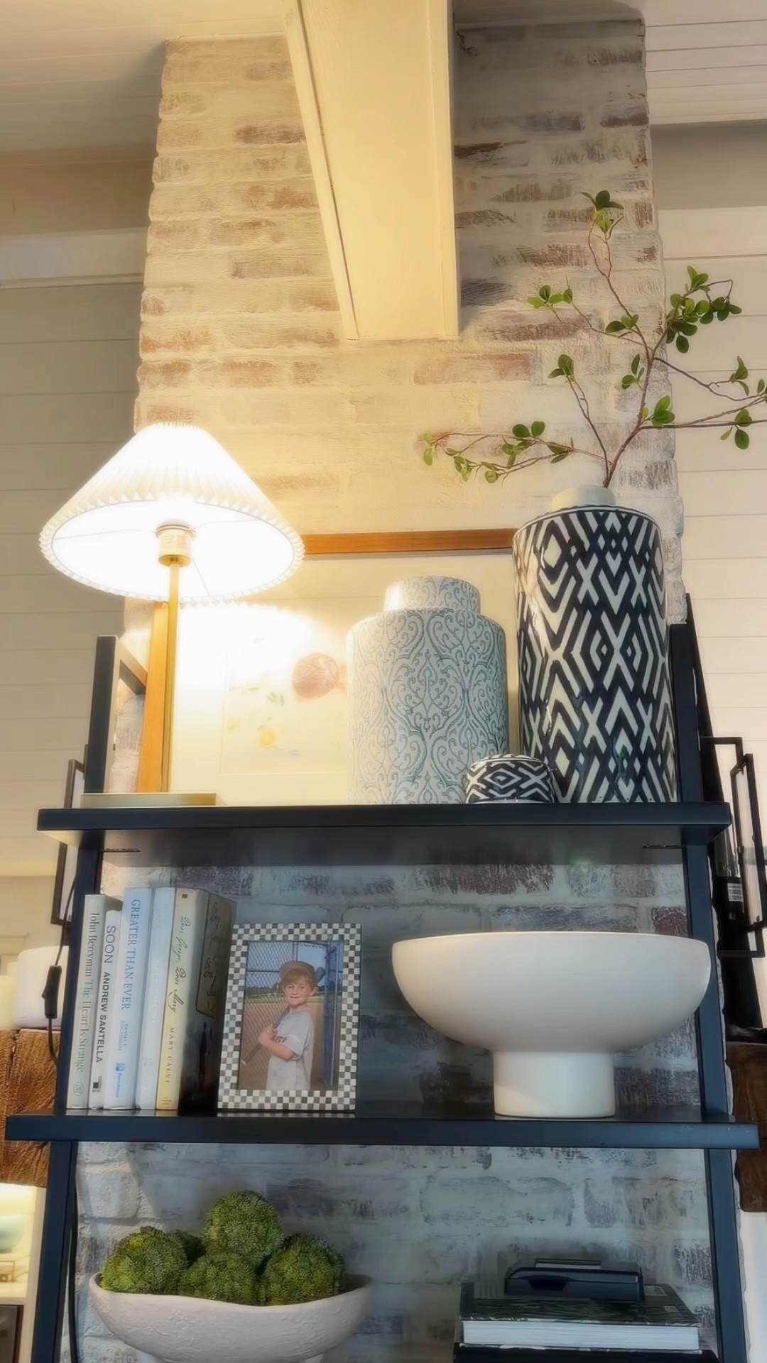 Shelving/bookcase decorating. 
The one glass cabinet I did votive candles and I have some kitchen glassware in there. It is a metal cabinet and I like to light the votive candles for ambience in there. The other side of this fireplace which sits in the center of the kitchen and living room, is an open shelving unit the height of the fireplace which is mostly a collected vibe. Some urns I’ve gotten over the years. I have switched up the placements on this shelving a few times. Which is what i enjoy doing. I do need a photo for the frame I just moved over. 

I’m sharing as much as I can from these spaces. Decorate with what you love 💗 check out my collections if you like any of the things that I love too!  💕 


#LTKHome #LTKvlog #LTKdayinmylife