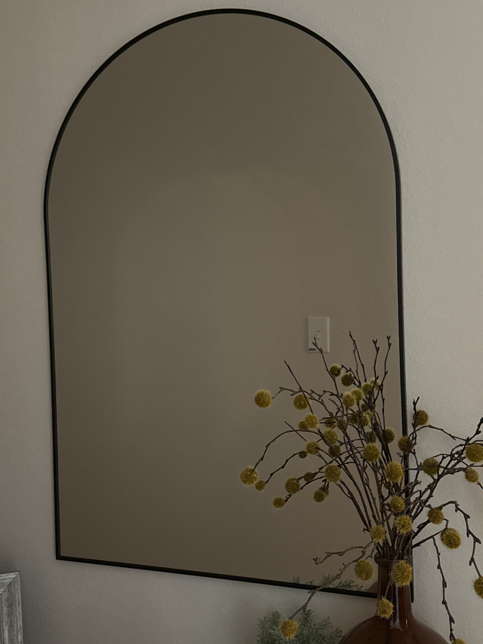 Love this arched mirror we added to our hallway. The thin black frame is just enough!

#LTKHome