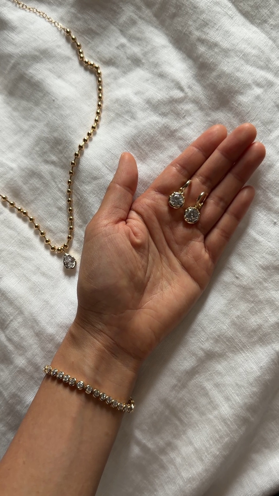 Found code stephie20 for 20% off!

Been very happy with my purchases from this small brand. I remove when showering  
• tennis bracelet 6” fits narrow wrists with a secure clasp and is so comfortable to wear. Also comes in a version with smaller stones 
• pear two tone Cleo necklace.
 I esp like that their charms can be mixed and matched worn on almost any of their different chains 

Quiet luxury Jewelry under $100, pendant charm necklaces