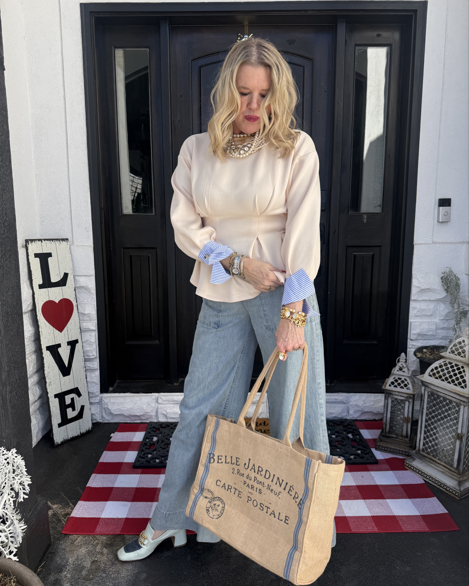 Outfit inspiration 
A mix of Splurge and save

Trending peplum tops

Save is the trending peplum top with dramatic stripe cuff detail
Fits tts in a med, soft knit top.
Great quality.

Save- French saying burtlap tote under $20 perfect for farmers market, travel or beach 

Free people chambray elastic waist wide leg pant with pockets  under $80
I am in the small 

Splurge- Madison Masion two tone loafers with gold chain 

Splurge- layers assortment of pearls, real pearls, French Kande  cc necklace and stone strands, Zenzie large rhinestone necklace 
And bee rhinestone necklace 
( sorry, this is a collection of vintages, real and not linkable pieces) 
I linked items you could get a very similar look with.

Earring pear and rhinestone target under $12 

Ring and brackets Julie voz 

#LTKOver40 #LTKgrwm #LTKootd