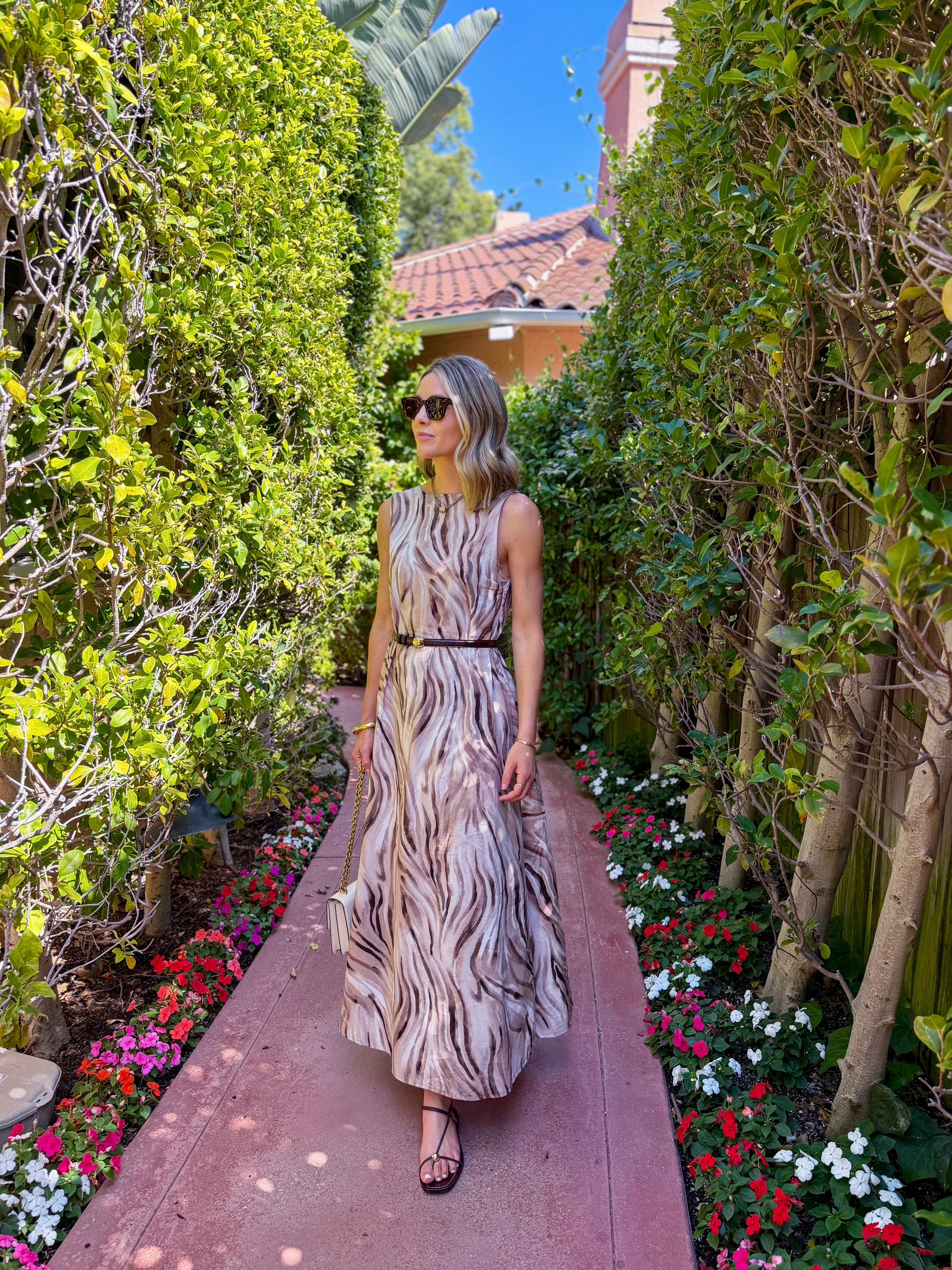 shopping day in LA! keeping it easy in this flowy printed dress with simple sandals, a skinny belt, and a little shoulder bag. i love that the neutral print feels summery enough for LA but still has those richer tones that work so well heading into fall.

such an easy one for a full day of walking, lunch, and popping in and out of shops without feeling too casual. wearing a size xs/s!  

 #LTKootd #LTKSeasonal