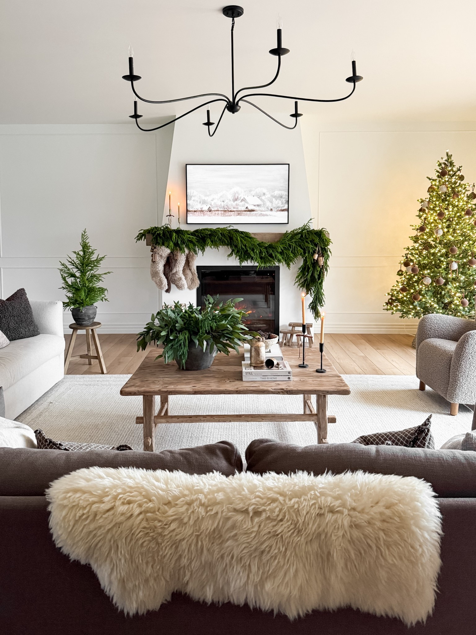 a cozy holiday moment in the living room. 🥰❄️☃️

Ps! My living room rug is on major sale right now for Black Friday! 

#LTKholiday #LTKsale #LTKhome