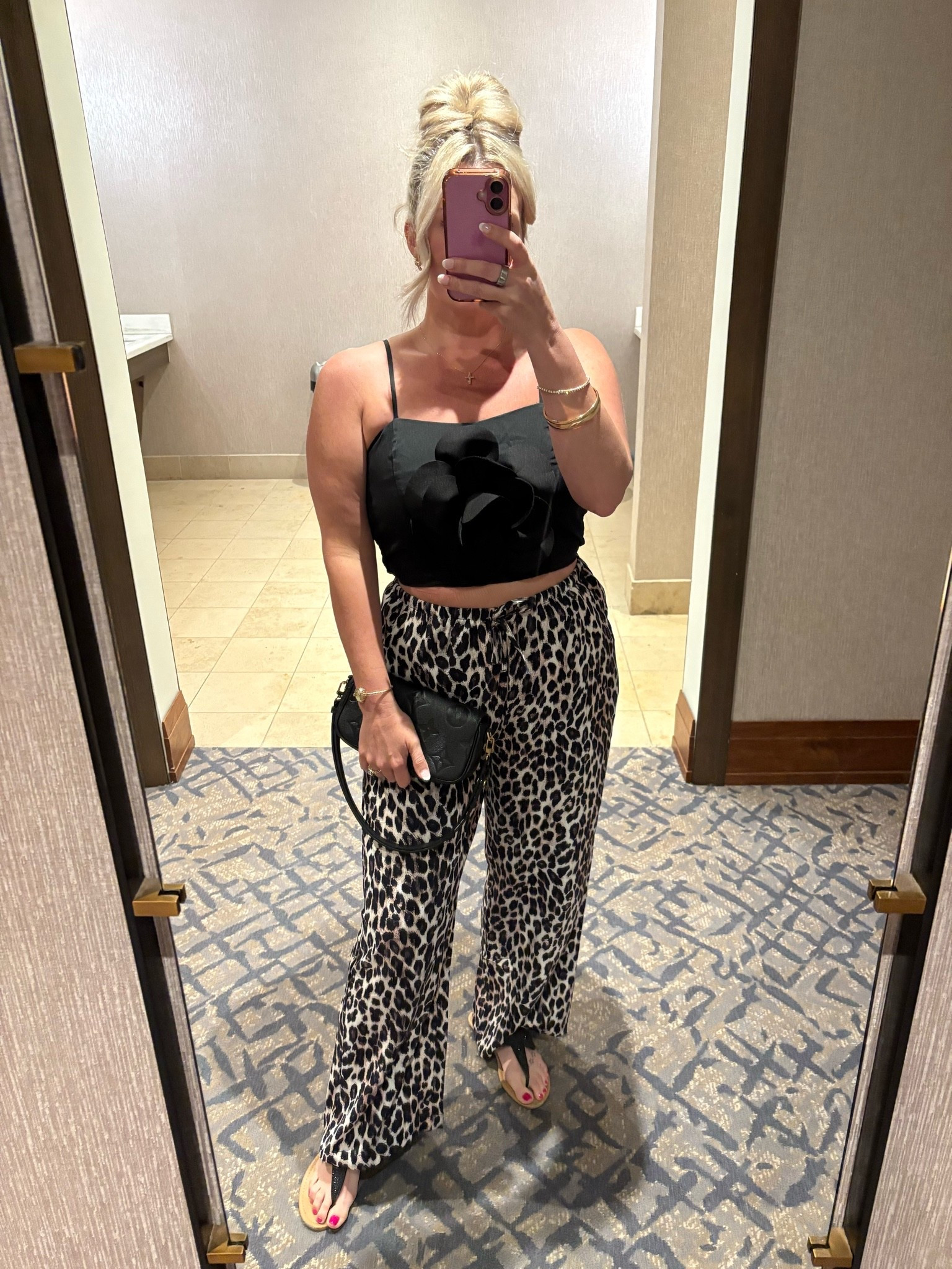 Love this too with the big floral embellishment! Looks designer but is under $30. Top is TTS, size 1 up on pants.

Date Night Outfit. Designer Inspired. Girls Night Outfit. Leopard Pants. Louis Vuitton. Summer 2026 Outfit

#LTKootd #LTKgrwm #LTKOver40