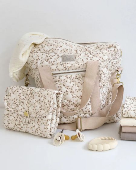 Quilted diaper and baby changing bag in a neutral floral print made from organic materials. Water repellent coated interior, minimal and lightweight. 

#LTKitbag #LTKbaby #LTKstyletip