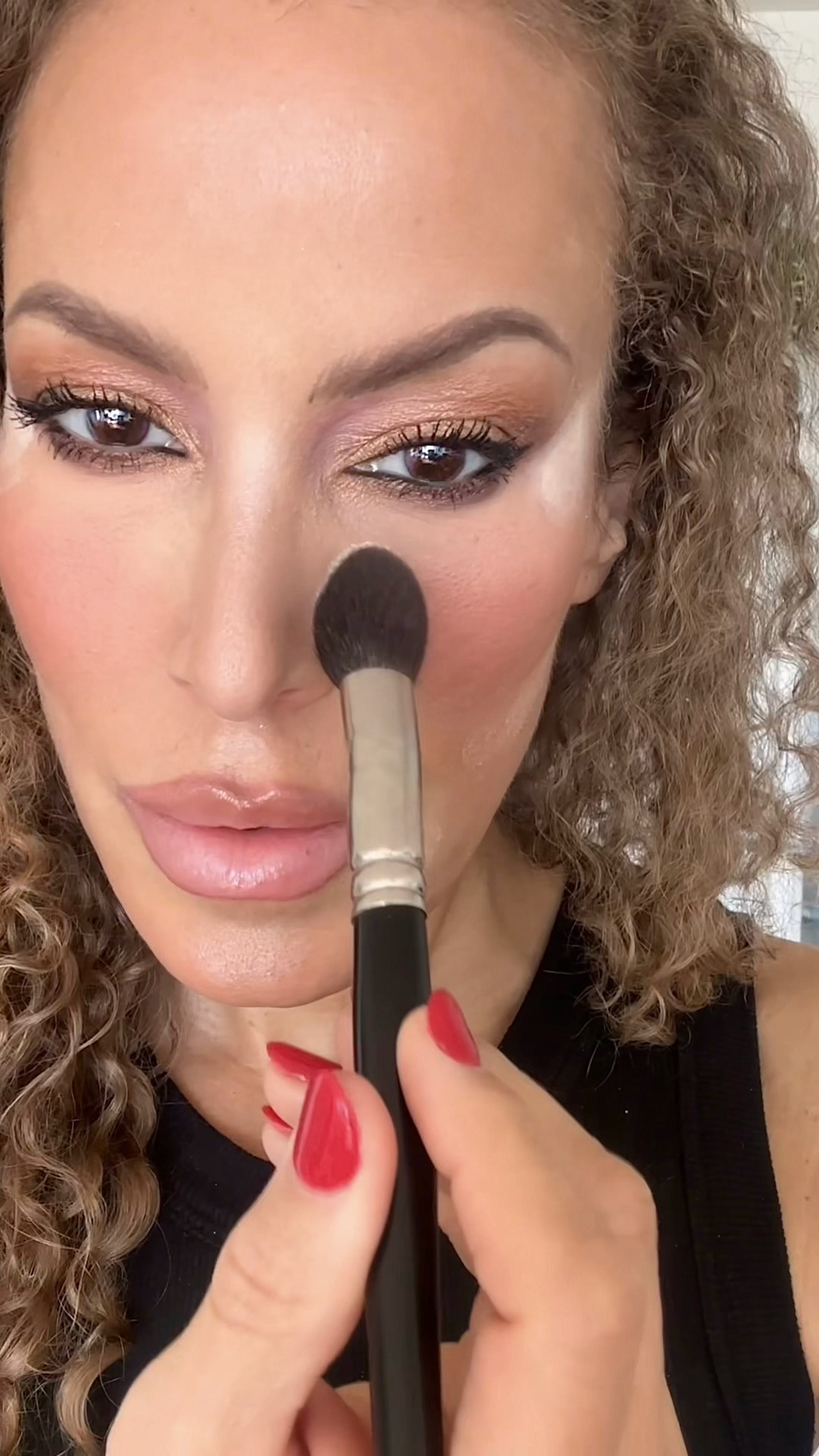 I sculpt the face and “reinforce” (brighten/add coverage) concealed/highlighted areas with baking powder.  Baking powder is more opaque than setting powder.  Baking is also a technique of putting an excess amount of any powder on, allowing it to dissolve into the skin, and brushing the excess off for more intensity and longer lasting oil absorption. 

From the Lorac Highlight & Contour Palette, I used the SHIMMER HIGHLIGHT on the sides of the eyes on an angle to “pop” my eyeshadow and the YELLOW HIGHLIGHT around my blush & between the brows to define the cheek, slenderize the nose & pop the lips.

Note how I used the SHIMMER WHITE on the bridge of my nose & center chin dusted off prior to filming.

