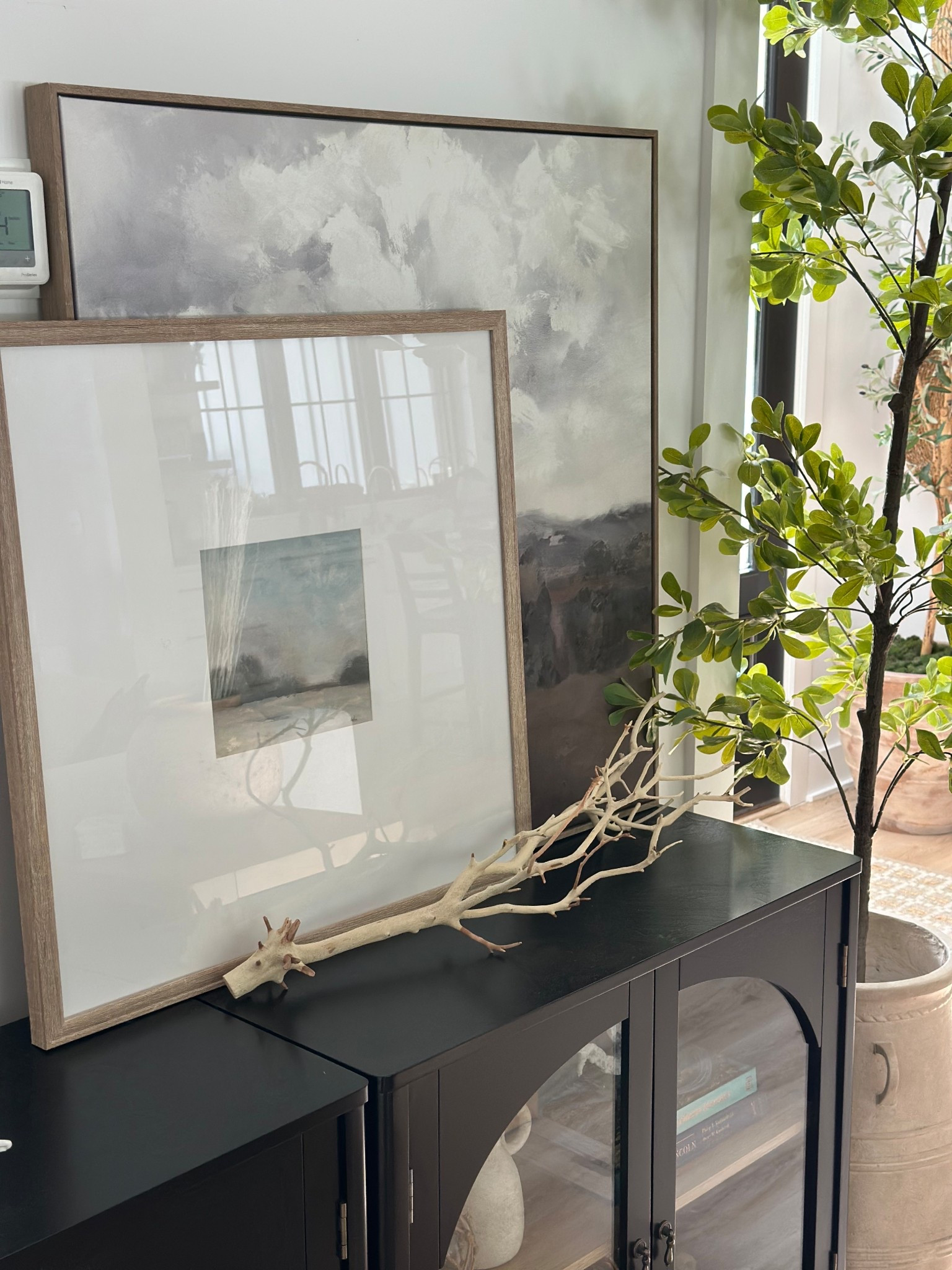 Lots of you were asking about our wall art in this picture. The one in the front is from Hobby Lobby but I can share the one in the back which is Target Studio McGee. I’ll also include our arched cabinets and tree from Amazon for those looking.

#LTKHome #LTKFindsUnder50 #LTKSaleAlert