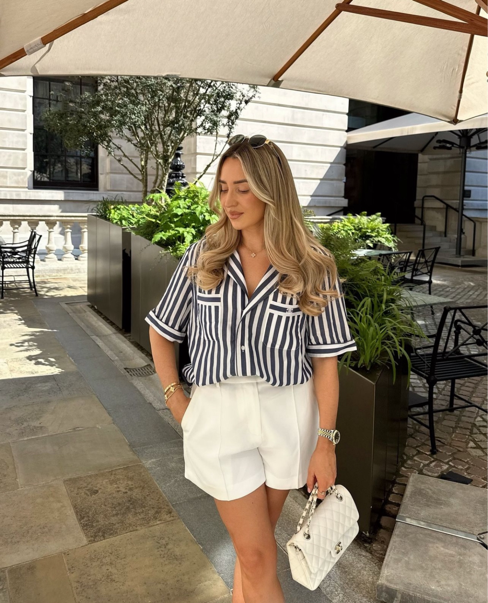 Naval stripes are a classic look for summer, and this Celine shirt was such a treasure to find at Bicester 🤍💙 Paired with some white tailored shorts from Reiss, Celine sunglasses, white Chanel bag and Hermes Oran sandals#LTKgetaway 

#LTKsummer #LTKluxury